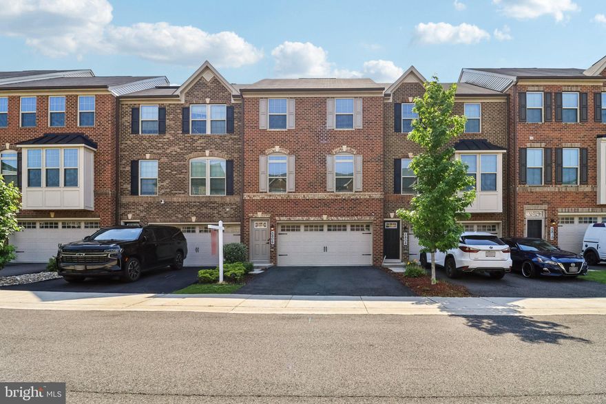 Shows like a model home! This move-in ready, spectacular townhouse features modern finishes throughout and an open-concept layout perfect for everyday living and entertaining. The state-of-the-art kitchen offers bright white cabinetry, pendant lighting, and a large center island, flowing seamlessly into the stylish living and dining areas. A convenient powder room and a slider to a spacious deck complete the main level. Upstairs, the primary suite includes a private ensuite bath, while two additional bedrooms share a beautifully updated hall bath. The fully finished lower level is ideal for a guest suite, rec room, or home office and provides direct access to the backyard as well as the attached 2-car garage. Welcome home!