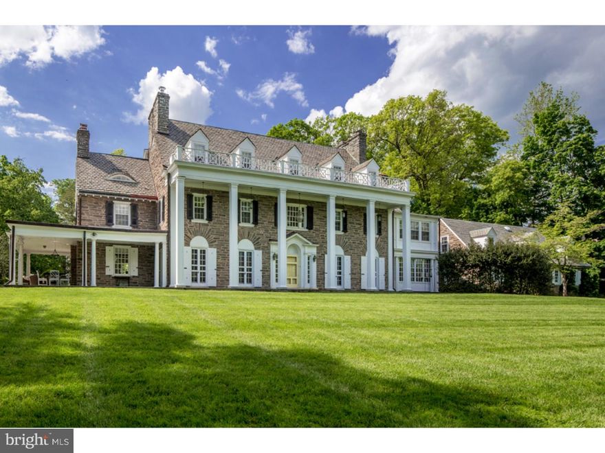 One-of-a-kind location, one-of-a-kind house, "Andorra House," is an exquisitely updated center hall stone Colonial nestled in one of the area's most desirable locations. Located just steps from the Northwestern end of historic Forbidden Drive and offering exceptional access to both the wonderful amenities of Chestnut Hill and the Wissahickon Valley section of Fairmount Park. Originally designed by noted architect Robert McGoodwin and built for William Harper, owner of Andorra Nursery. Once surrounded by several hundred acres, the home is filled with many original details including multiple fireplaces, high ceilings, gorgeous woodwork, exceptional moldings and deep windowsills, along with many modern updates; this home offers gracious spaces for everyday living and entertaining. Light-filled grand center entrance hall; large formal dining room with fireplace; living room with custom lighting, built-ins, gas burning fireplace and multiple French doors; study with fireplace and access to the large covered porch with fireplace. A totally renovated gourmet kitchen, with Viking and Sub-Zero appliances, Carrara marble countertops and radiant heated slate floors with adjoining sunlit breakfast room are perfect spaces for family gatherings. The rear bar room/den, a convenient mud room and rear powder room offer easy access to the attached garage and a separate, large, one bedroom in-law suite with recently renovated kitchen. The spacious master suite with fireplace offers an updated bath, attached dressing room with fireplace and ample closet space. There are two additional bedrooms, each with ensuite baths, and a second floor laundry. The third floor offers three bedrooms, a media room with surround sound, two hall baths and crafts room. All set on 1.62 lovely landscaped acres, this absolutely immaculate home is conveniently located and move-in ready. Don't let this treasure pass you by!