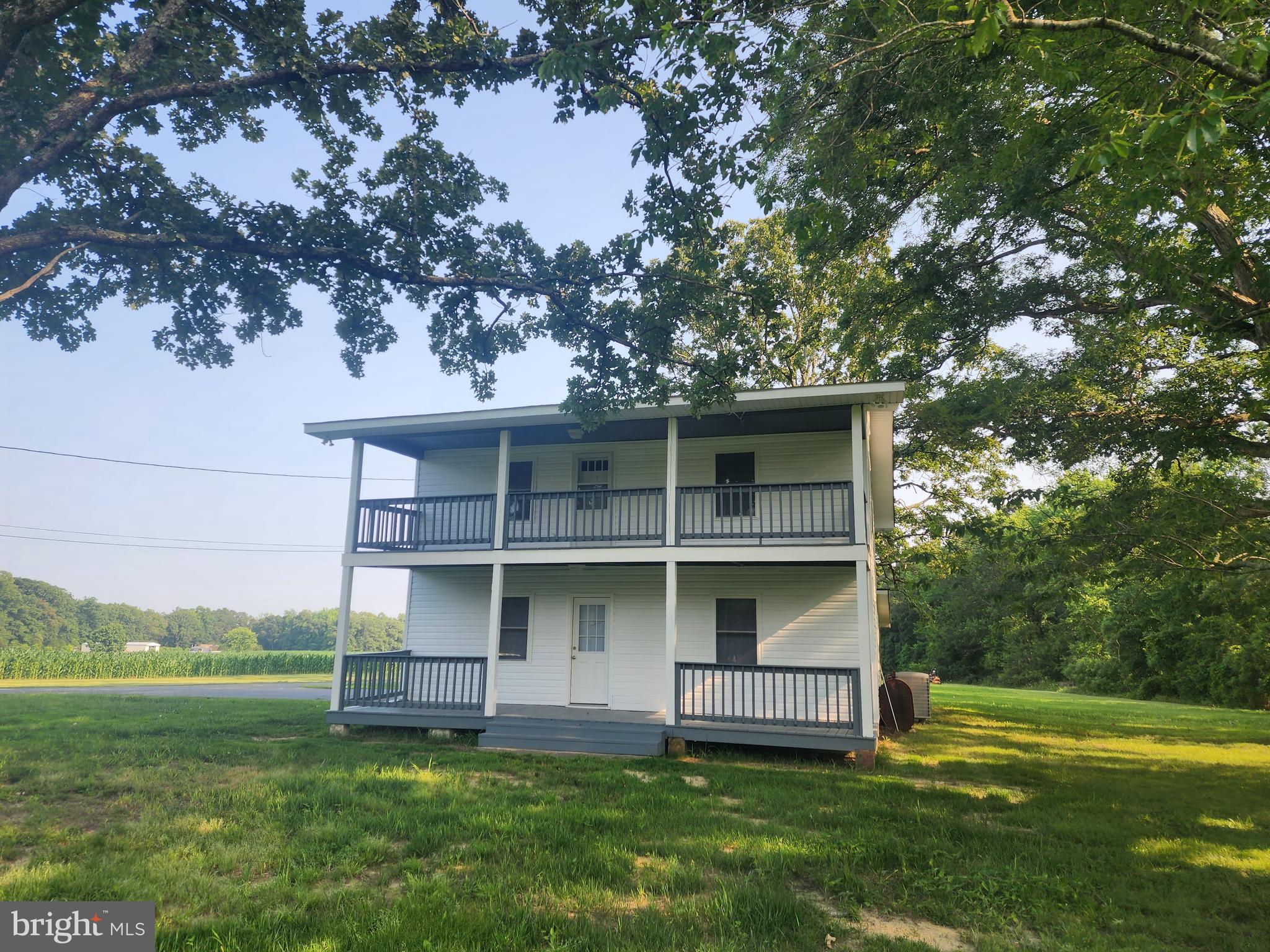 Awesome farmhouse located on 3 acre lot. 5 bedrooms 2.5 baths. Large eat in kitchen, dinning room off kitchen, family room/office, living room and 1/2 bath on main level. Upstairs you will find 1 main bedroom with attached full bath and 4 other bedrooms & full bath in the hallway. Fully renovated; new baths, new kitchen cabinets, flooring, new paint throughout, new carpet, new led lighting, new insulation, energy efficient. Craft, canning room or mud room off large screened porch in back of home. 2 large front porches to enjoy the view. Large front and back yards. Large laundry room. 3 car oversized detached garage. "CITY CLOSE AND COUNTRY QUIET"