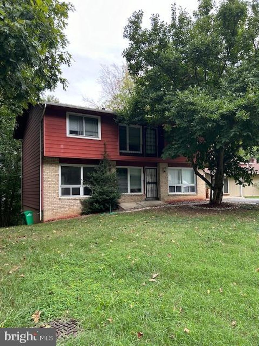 Single Family home with 4 bedrooms, 2.5 baths, 3 levels, hardwood floors, finished basement. Freshly painted, large rear yard, mature trees, carport, fireplace.  Updated baths with dated vanities & lighting. kitchen with newer counter tops and stainless-steel appliances. Newer HVAC. Off street parking and carport. Screened porch off main living area. 2 family rooms one on main with fire place and another in the basement. Large storage laundry area. LEAD FREE CERT.