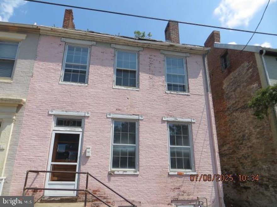 Charming All-Brick Townhouse in Historic Downtown Frederick County
Step into the charm of historic downtown Frederick with this solid all-brick semi-detached townhouse, brimming with character and potential. Featuring 3 spacious bedrooms and 1 full bath, this home is perfect for investors, renovators, or history enthusiasts looking to bring new life to a classic property.
Inside, you’ll find original hardwood floors, multiple fireplaces, and timeless architectural details that speak to the home’s historic roots. A fully floored attic offers the opportunity to create additional living space — ideal for a fourth bedroom, home office, or studio.
The fenced backyard provides privacy and room to garden, relax, or entertain. With great bones and unmatched character, this property is a rare opportunity to own a piece of Frederick’s storied past while adding your own modern touches.
Don’t miss your chance to transform this gem into something truly special — schedule your showing today!

Thank you  Chatgpt for the wonderful introduction. Now for the fine print. This property is ROUGH. Everything proceeding this is true but it NEEDS WORK. A little more than T-L-C and a little less than T-N-T but if you have vision and like the rough stuff, then this is for you. The home is sold AS IS , WHERE IS and the seller will not entertain any repairs. This would make an excellent AIR BNB or rental/rooming house if permitted. Buyer is responsible for verifying allowable usage.