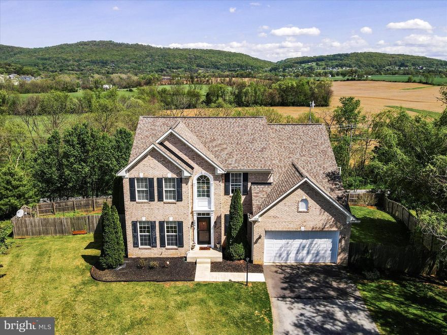 Meticulously maintained home in desirable Crestview community, with panoramic mountain views from the back deck. Upon entering this home you will be delighted by the bright, clean and fresh state of this home. The sellers have left no stone unturned and the home shines. Home features large rooms and plenty of space for the family. Main level features family room with mountain views, living room, dining room, office, laundry room, kitchen with island, lots of cabinets for storage, pantry, bump out sitting room/dining area, gas fireplace, coat closet, half bath, hardwood in office, dinning room and living room.  Upstairs features hardwood floors, 4 bedrooms, 2 full baths, the primary suite offers marble double vanity, LVP floor, linen closet, water closet, separate shower, soaking tub and 2 large walk-in closet. Hall bath offers granite countertop and LVP floor. Finished walkout basement with half bath. All around home for comfortable living and entertaining your family and friends! Outside you will find a cedar privacy fence around the yard, 2 patios, 2 level trex deck with hot tub and spectacular views of the mountains. You can also enjoy views of 4th of July fireworks.  

UPDATES: Roof replaced 2019. Washer/dryer purchased 2024, water softener 2024, hot water heater 2022, main HVAC unit Aug. 2016, deck 2016, tile on main level 2023, 2 full baths upstairs remodeled 2024, cooktop & microwave 2025. Home power washed  April 25 2025.