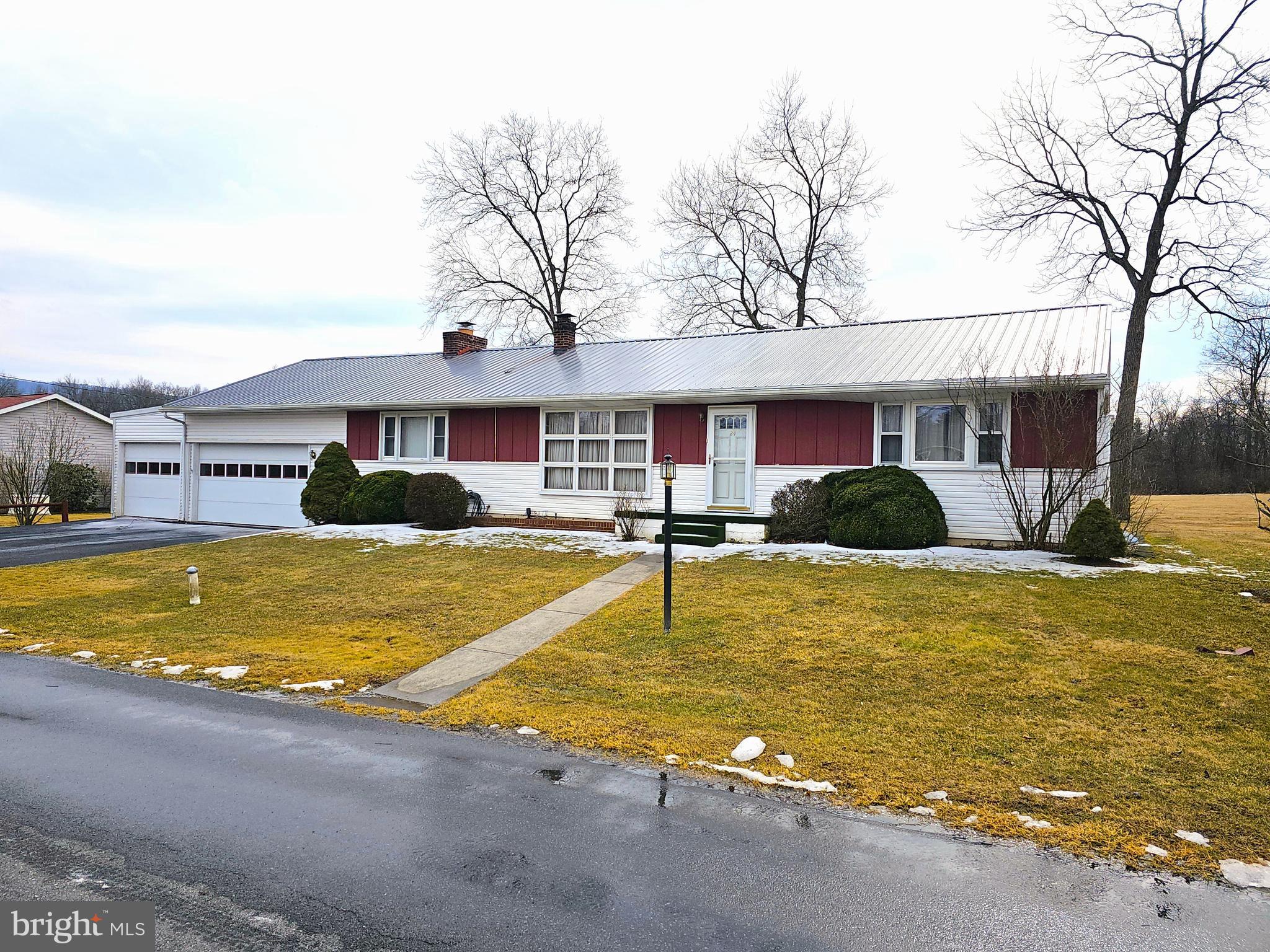 This well-situated ranch home located just outside of town on a quiet dead-end street, offers comfortable living with 3-4 bedrooms, 2 bathrooms, large living room, a kitchen and dining room and a 2.5 car garage. The interior features a blend of hardwood and newly installed vinyl plank flooring. Laundry area is conveniently located on the main level. Move right in and enjoy relaxing on your screened-in back porch.