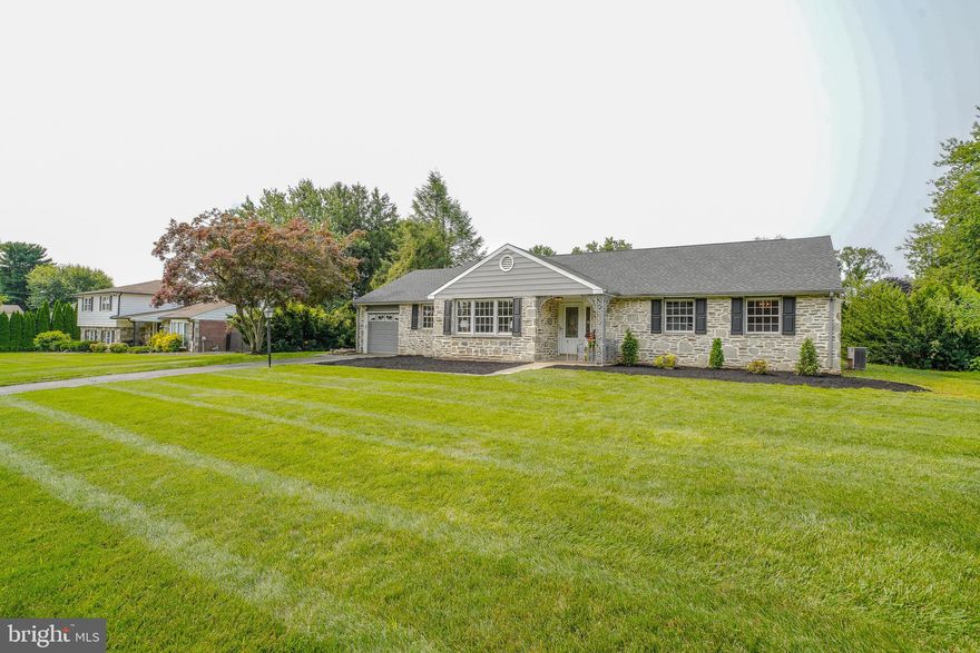 Renovated home in award winning Lower Moreland school district ready for the distinctive new home owner.   The ease of living in a  large roomy ranch home is what this house  offers.  Brand new flooring through out the main and lower level is what you will notice as you enter into the large entry foyer.  The oversized living room  flows right into the formal dining room for your entertaining.  Your  eat - in kitchen boasts new cabinetry with quartz counter tops and designer back splash.  The high end stainless steel appliances and range hood add to this beautifully designed kitchen. Behind the kitchen is the laundry room that is convenient to the back yard and garage.  Overlooking the back yard in the center of the house is is a den/office room with a door that opens to a large covered patio.  Separated by the den and the foyer in the other side of this large ranch home  are  the private bedrooms and hall bath  The main bedroom has a full bathroom with a lighted vanity and the shower that has custom tilework.  There are two other good size bedrooms with ample closet space.  Work your way down to the lower level, to a large finished basement, with approximately an extra 875 square foot of living space ready for you to use as more entertaining space, manspace, or what ever your needs may be!  There is an open floor concept throughout the main large room from front to back of this lower level.  Another room is there that could be used for a game room or office.  A  large utility room with plenty of space for storage is also on this level and another large closet for your storage. You will be impressed with the size and the beauty of this lower level.