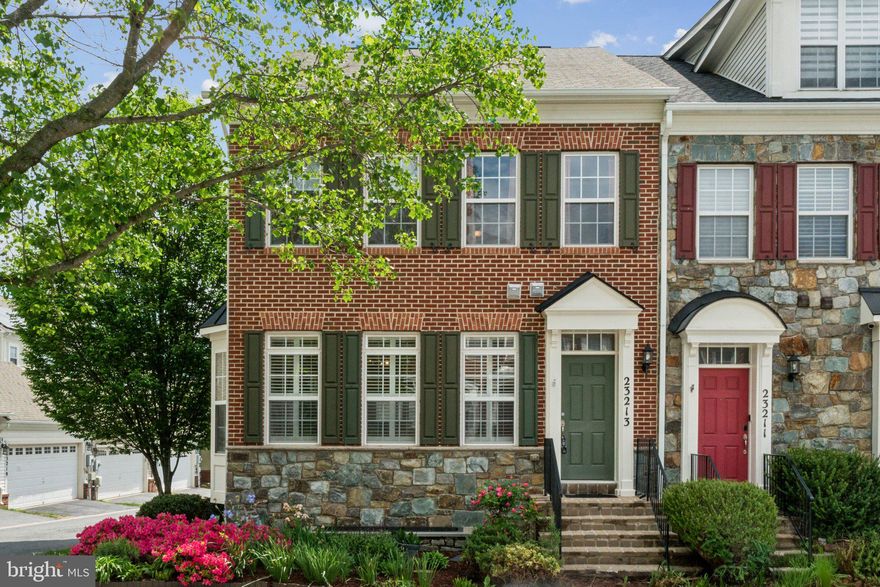 Centrally located in sought‑after Clarksburg Village, 23213 Rainbow Arch Drive is a beautifully appointed three‑story end‑unit townhome that shines with natural light and modern finishes. Welcome home to an open‑concept main level where hardwood floors flow seamlessly beneath 9‑foot ceilings and expansive windows. The chef’s kitchen delights with granite countertops, stainless steel appliances—including a gas range—ample cabinetry, a generous island with breakfast bar, and a pantry for serious storage.  

Ascend to the upper level to find a vaulted‑ceiling primary suite complete with large walk‑in closet and a spa‑inspired bath featuring dual vanities, ceramic tile flooring and a soaking tub. Two additional bedrooms, each bathed in sunlight and serviced by a hall bath with beautiful‑accented fixtures, offer comfort and style for guests or family.  

The lower level is your versatile retreat: newly carpeted floors set the stage for a recreation room, home office, or guest space—complete with a bedroom and full bath. Enjoy evening barbecues or morning coffee surrounded by mature landscaping, then tuck vehicles and gear away in the two‑car detached garage.  

Beyond your door, Clarksburg Village amenities beckon—resort‑style pool, fitness center, clubhouse, playgrounds, and miles of scenic trails. Commuters will appreciate quick access to I‑270, MD‑355, and Metro‑shuttle service, while Clarksburg Town Center, outlets, and local parks offer endless shopping, dining, and recreation.