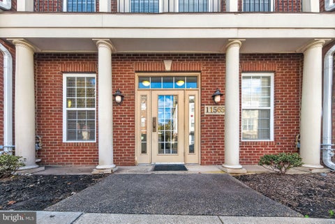 Photo of 11565 Cavalier Landing Court #101, FAIRFAX, VA 22030 (MLS # VAFX2346496)