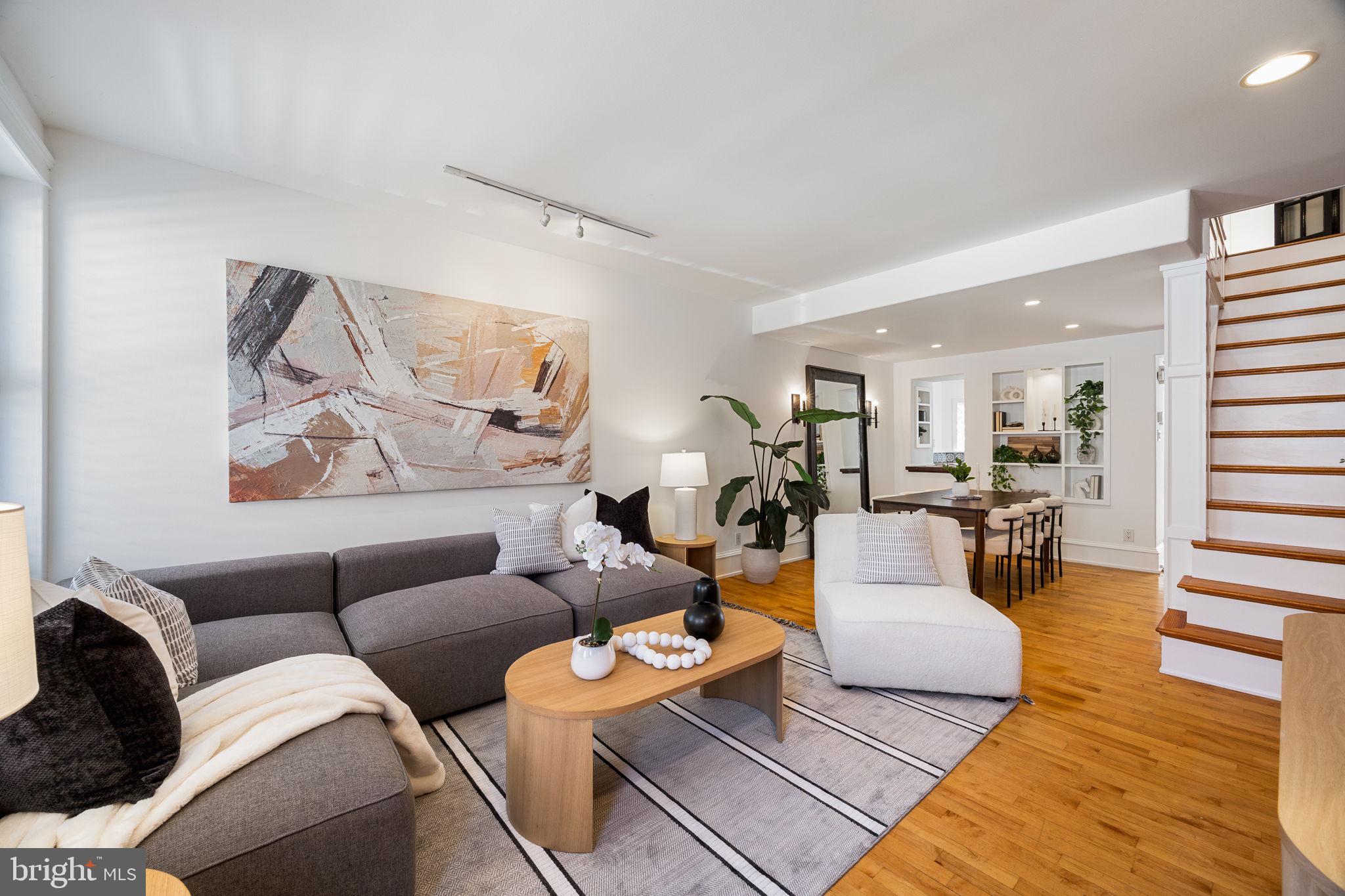 Welcome to Fairmount living with flair. This freshly styled townhome knocks it out of the park, sitting on a quiet, tree-lined street with the rest of the city at your fingertips. Exposed brick, hardwood floors, and designer shutters welcome you inside with floods of natural light, while custom built-ins adorn the dining room. Steps away, a beadboard-ceiling kitchen with brightly tiled backsplash and gas cooking brings the heat (and, well, charm). Upstairs, discover a spacious bedroom, full laundry room (no more basement treks), and a double-vanity bathroom. The third floor adds a skylit bedroom plus a bonus room, perfect for a home office, nursery, oversized closet, or Zoom space, with balcony access to the roof deck—your private perch for city sunsets, skyline selfies, and al fresco entertaining. The finished basement offers tall ceilings, a half-bath, and additional storage, and with a Walk Score of 92 and Bike Score of 96, everyday errands and nights out are a breeze. Updated, move-in ready, and brimming with character, this one is quite simply a home run. Schedule your showing today!