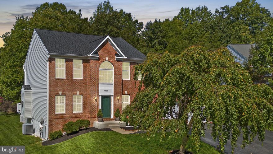 Welcome to 7802 Aylesford Lane in the sought-after Villages at Wellington community! Stunning brick front colonial with upgrades galore! Walk inside and you are greeted by the lovely two-story foyer with tons of natural light, windows galore, and open-concept living! The large foyer is nestled between the living and dining rooms with hardwood floors and plantation shutters! Spacious kitchen with 42" cabinets, granite counters, custom backsplash, stainless steel appliances, and a separate pantry! The sunfilled sunroom with skylights (with remote blinds) offers access to the large deck and spacious rear yard. The kitchen opens to the family room with a gas fireplace and mantel! Upstairs you'll find four bedrooms and two full baths including a primary suite with a large walk-in closet and an ensuite luxury bath with a soaking tub, separate shower, and dual vanities! The basement is an open slate with tall ceilings, a bathroom rough-in, and space galore! HVAC '13!, Interior Paint '24!,  Roof & Skylights '2016! In addition, the HOA provides a club house with a pool, tennis, and pickle ball courts! Hurry, this beauty will NOT last!!