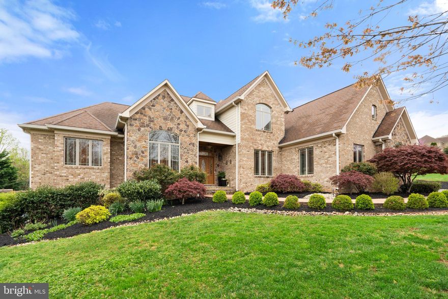 This custom-built home has three levels of sheer perfection!  The main level is a dream, featuring an elegant yet comfortable owners' suite,  great room with soaring ceilings, library and gourmet kitchen which opens to the family room.  Step outside to a lovely screened porch, perfect for alfresco dining, and large covered porch overlooking the pool.  The upper level has 4 spacious bedrooms and 3 full baths.  The lower level is filled with plenty of natural light with walkout to the patio.  It offers numerous possibilities as an in-law or au-par suite.  The back yard is an oasis and entertainer's delight with a heated pool, hot tub and beautiful patios...and the sunsets are amazing.  The owners have recently added a 20' X 30' garden with raised boxes and over 100 trees and shrubs creating a lush and private setting on all three sides of the back.  The 2-story detached garage is perfect for additional parking, workshop, studio, gym and more.  This home is immaculate, beautifully maintained and updated and ready for you to call "home"!