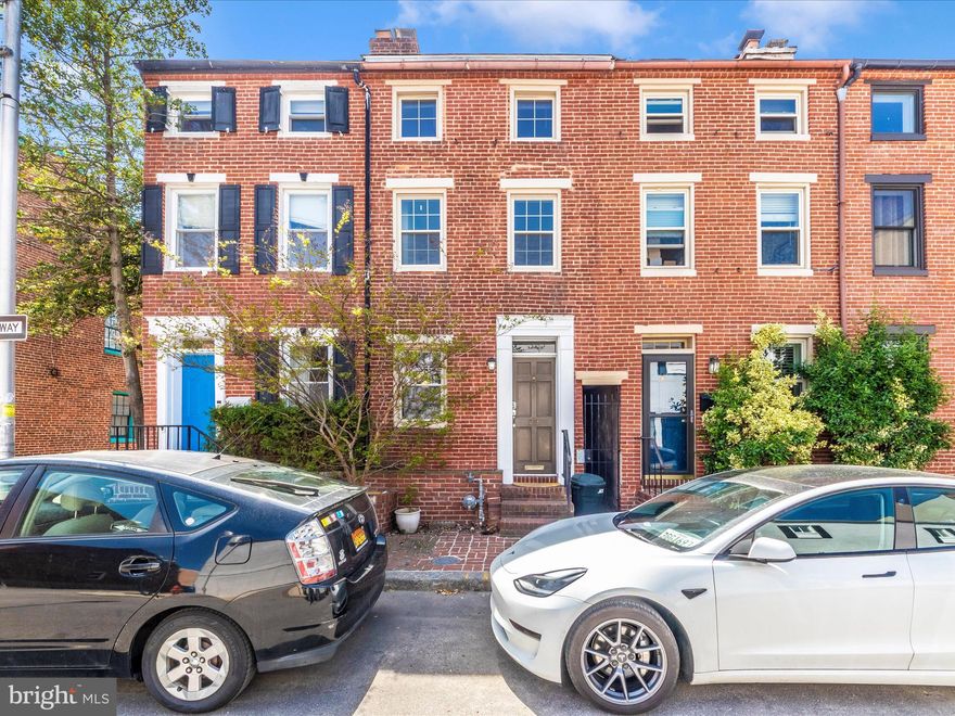 **Charming Federal Hill Gem!** Welcome to 23 E Wheeling Street, nestled in the heart of Baltimore's highly desirable Federal Hill neighborhood. This delightful 3-bedroom, 2-full bath home offers the perfect blend of historic charm and modern convenience, all within minutes of vibrant dining, entertainment, and picturesque parks.

Step inside and be greeted by gleaming hardwood floors that flow throughout the home, complemented by the character of exposed brick walls. The main level features a welcoming living room, complete with a cozy **wood-burning fireplace** – ideal for chilly evenings. The expansive kitchen is a true highlight, boasting elegant granite countertops, an abundance of cabinet space, and room for a dining table or a convenient kitchen island. From the kitchen, step out to your own private and fenced backyard, a perfect oasis for relaxation or entertaining.

Venture upstairs to discover two well-appointed bedrooms. The second bedroom offers a unique feature: its own private balcony, providing a lovely spot to enjoy the neighborhood ambiance, and the added warmth and charm of a **wood-burning fireplace**. Ascend to the entire third level, which is dedicated to a luxurious and private Primary Bedroom suite. This spacious retreat includes a cavernous private bathroom, offering a spa-like experience.

The basement is unfinished, presenting a blank canvas brimming with potential for customization to suit your specific needs – whether you envision a home gym, recreation room, or additional storage.

Location is everything, and this home truly delivers! Enjoy the convenience of being just moments away from Federal Hill Park, offering stunning panoramic views of the city skyline and Inner Harbor. Sports enthusiasts will appreciate the close proximity to the stadiums of the Baltimore Orioles and Baltimore Ravens. Federal Hill itself is a vibrant neighborhood brimming with an array of fantastic restaurants, lively bars, and diverse entertainment venues. With its prime location, you'll also have easy access to downtown Baltimore, all major highways, BWI Thurgood Marshall Airport, and various public transportation options, making commuting and travel a breeze. Don't miss this incredible opportunity to own a piece of Federal Hill charm!