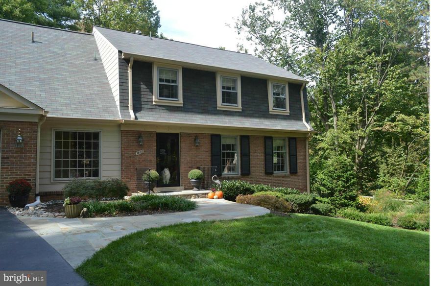 Gorgeous!.Beautifully updated home on serene half-acre; close-in Barcroft Woods. Filled w/ sunlight, gleaming hardwood grace the main & upper floors.The Mst suite, one of four generous BRs,offers a full dressing room. A large travertine floored dream kitchen opens to an adjoining Fam Rm. Step out to the paved patio and stunning hillside view. Bike to E Falls Church Metro or  nearby Farmers Market.