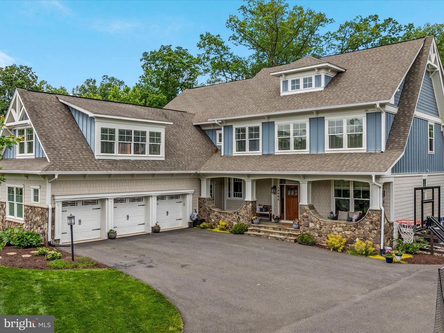 ***Open House Canceled! Under Contract***Step into luxury and sophistication in this extensively upgraded Colden model boasting nearly 7,000 finished square feet on a private, wooded lot just under two-thirds of an acre, with tranquil seasonal lake views. The exterior showcases timeless Hardiplank siding with stone accents and a welcoming front porch. Inside you'll find soaring 10-foot ceilings, 9.5-inch wide plank engineered hardwood floors, and custom craftsman trim that create a warm yet refined atmosphere. The spacious foyer opens to a formal living room and an elegant dining room that overlooks the lush, tree-lined backyard. A private office sits tucked away just off the entryway, while the gourmet kitchen is a chef’s dream featuring GE Monogram appliances, an industrial range with stainless steel hood, second oven, beverage fridge, upgraded quartz countertops—including an extra-thick quartzite island—and a striking tile backsplash that reaches the ceiling. The kitchen flows seamlessly into a sunny breakfast area and an expansive family room centered around a stone fireplace with custom wall sconces. Step outside to a large, covered Trex deck nestled among the trees—perfect for entertaining or simply enjoying the views. Off the family room is a second study with custom built-ins. The mudroom offers cleverly designed cabinetry with hidden storage and a rear staircase. The main staircase features satin black iron balusters paired with white oak newel posts and handrails. Upstairs, the grand primary suite is a serene retreat with peaceful treetop views, two custom California Closets, and a spa-inspired bath with dual vanities, soaking tub, separate shower, and water closet. All secondary bedrooms include en suite baths and walk-in closets. A spacious fifth bedroom with wet bar and private bath is ideal as an in-law suite, media room, or guest retreat. The laundry room adds convenience with its custom cabinetry, tile backsplash, and sink. The walk-out lower level is built for both relaxation and entertainment. It includes a second kitchen with upgraded finishes, a large recreation space featuring a high-definition golf simulator, a versatile art or pet room, a music room, and a sixth bedroom with full bath and walk-in closet. The oversized three-car garage is equipped with epoxy flooring (lifetime warranty), EV charger, a motorized two-car lift, and a motorized bike lift. Outdoor spaces are equally impressive, with professionally landscaped front and backyards, stone retaining walls, brick paver patio and walkways, and premium artificial turf that is pet- and eco-friendly. Additional upgrades include oversized gutter guards, a new upstairs HVAC system with the highest efficiency model available, a full sprinkler system, and plantation shutters throughout. Situated in a sought-after waterfront community with access to lakeside trails, fishing spots, firepits, campsites, a pool, and more—all just minutes from premier shopping, dining, top-rated schools, and major commuter routes. This offers upgrades you won't find anywhere else and is truly one-of-a-kind!