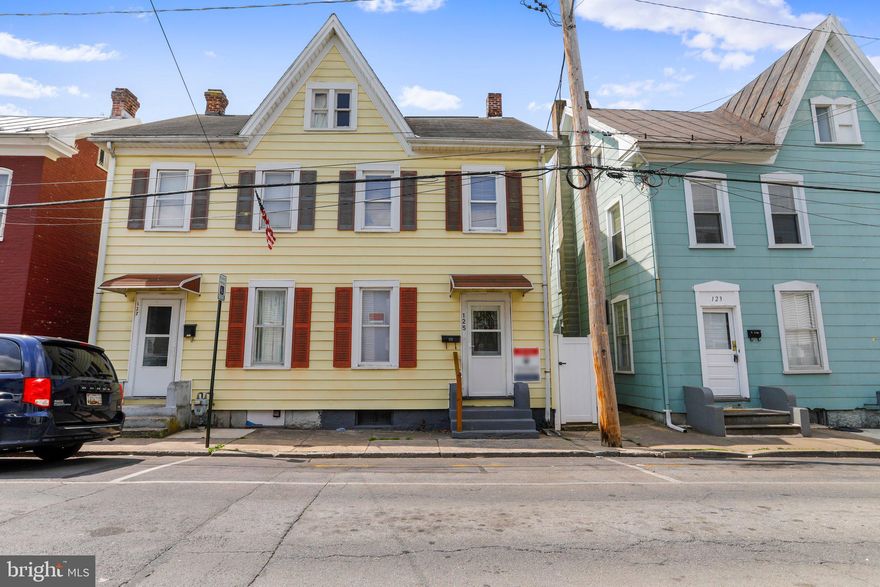 3 Bedroom 1 Bath End Unit. NEW CARPET AND PAINT THROUGHOUT. Main level has the Living Room, Dining Room, Large Kitchen with stainless appliances including the built in microwave, electric stove/oven, dishwasher, and refrigerator. Upper level rooms all have ceiling fans. Upper level 2 is a floored attic with walk up stairs. Unfinished lower level has the utility room ad laundry area. Privacy fenced rear yard which extends to the detached garage.