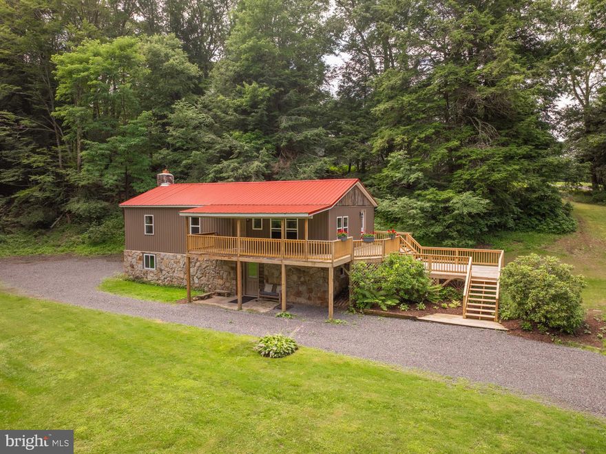 Experience a fresh start in this stunningly completely renovated stone-raised rancher, perfectly situated along the breathtaking Cherry Creek! Every detail of this home has been thoughtfully upgraded, blending modern convenience with the beauty of its natural surroundings. The main level features 3 spacious bedrooms, an updated full bath, and engineered hardwood flooring throughout. The brand-new kitchen shines with custom cabinetry, gleaming granite countertops, and a new stove. Downstairs, endless possibilities await whether it's a cozy family room, game room, or creative space anchored by a striking floor-to-ceiling stone wood stove. Lower level also includes an additional bedroom or office, a half bath designed in an outhouse style (without a sink), and a utility room with a sink. Major updates include converting overhead electric to underground, all-new windows, new siding, new doors, and an upgraded 200-amp service with a new panel, breakers, and wiring. Zoned hydronic baseboard heating ensures efficiency in every room, complemented by a new hot water tank, pressure tank, and water conditioning system. The sellers is offering a home warranty for the new buyer and a $1,500 allowance toward the purchase of a new refrigerator with an acceptable offer. Enjoy peaceful Creekside living in a home not located in a flood plain, all while being just moments from the heart of Oakland, MD -don’t miss this incredible opportunity!