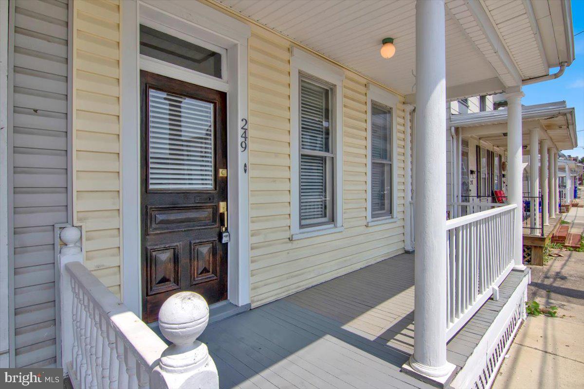 Introducing 249 S Mulberry Street in Hagerstown, MD – a stunning 3 bedroom, 2 bathroom home with beautiful features and an unbeatable location. From the inviting porch at the entrance and gleaming hardwood steps to the large living room and adjacent dining area with its bay window, this is a property that you won’t want to miss. The newly-updated kitchen has crisp white cabinets, stainless steel appliances, granite countertops, and new flooring for an enviable look and feel. Who doesn’t love cooking in a spotless kitchen like this one? And who can forget the convenient backyard access? Head upstairs to find three spacious bedrooms plus an office room for various activities. There’s even a full bathroom for your convenience! One of the bedrooms also boasts a private balcony – perfect for enjoying those sunny summer evenings now that the warm weather is here! Your search ends in the basement where you’ll see a very stable concrete flooring that houses a furnace, electric water heater, and washers/dryers. Plus there’s a fenced-in backyard as well as a one-car garage – ideal for a workshop or light storage needs. 249 S Mulberry Street will check off all your boxes: it’s tastefully updated wild hosting all the modern touches you could ask for. Its location makes it easy to access major roads I-70 and I-81 while shopping and restaurants are just moments away when you need them! This property won’t last long so act now before you miss out on your dream home!