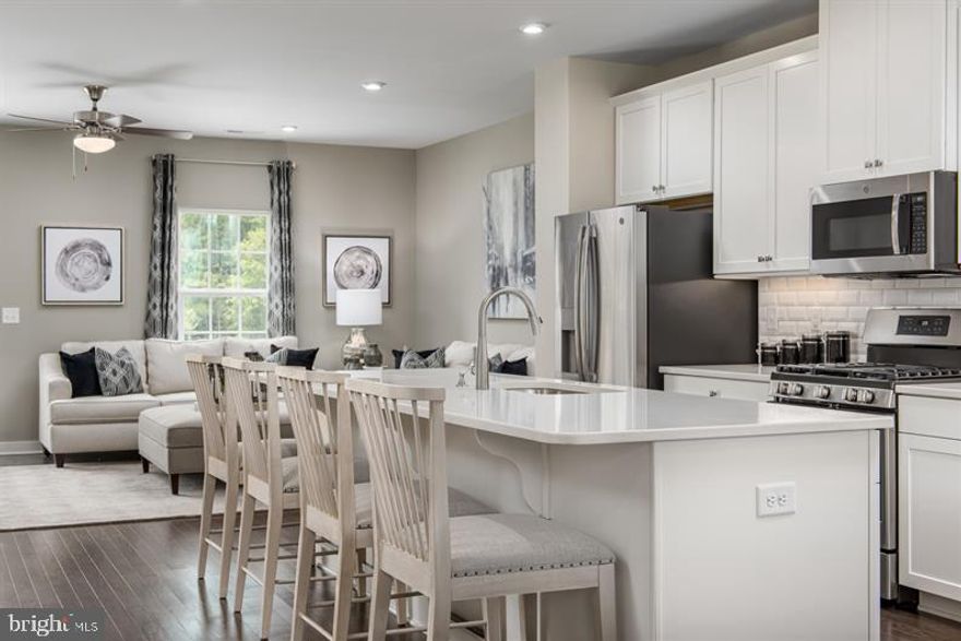 To be built Schubert at Lake Linganore Oakdale by Ryan Homes. T he largest of the Composer II series homes, offers the space and customizing details of single-family living with the convenience of a townhome. On the main living level, you?re greeted by an enormous and airy kitchen with a huge island perfect for entertaining. The dining room provides space for a more formal meal while the great room is perfect for movie night evenings at home. Up a flight of stairs designed to be elegant and functional, the upper level boasts three bedrooms, two baths, and a full sized 2nd floor laundry with extra shelf space and an optional laundry tub. No need to worry about storage space ? generous closets abound in both bedrooms. The Owner?s Bedroom is a private retreat accented with an optional tray ceiling and featuring an enormous walk-in closet. The Owner?s Bath boasts a soaking tub and separate shower with seat and a dual vanity for the ultimate in convenience There is so much to do both in and around the community: Walkable to top rated Oakdale Schools, Walkable to future town center, <1 mile to I-70, 10 minutes to Downtown Frederick, 25 minutes to Howard County & Montgomery County, Dining and shopping are down the street: Wegmans, Lowe?s and more! Everything you want to enjoy is within easy reach of your new home at Lake Linganore Oakdale. Other floor plans and home sites are available. Photos are representative. Ryan Homes is taking precautionary measures to protect our valued customers and employees. Our models are open by appointment.