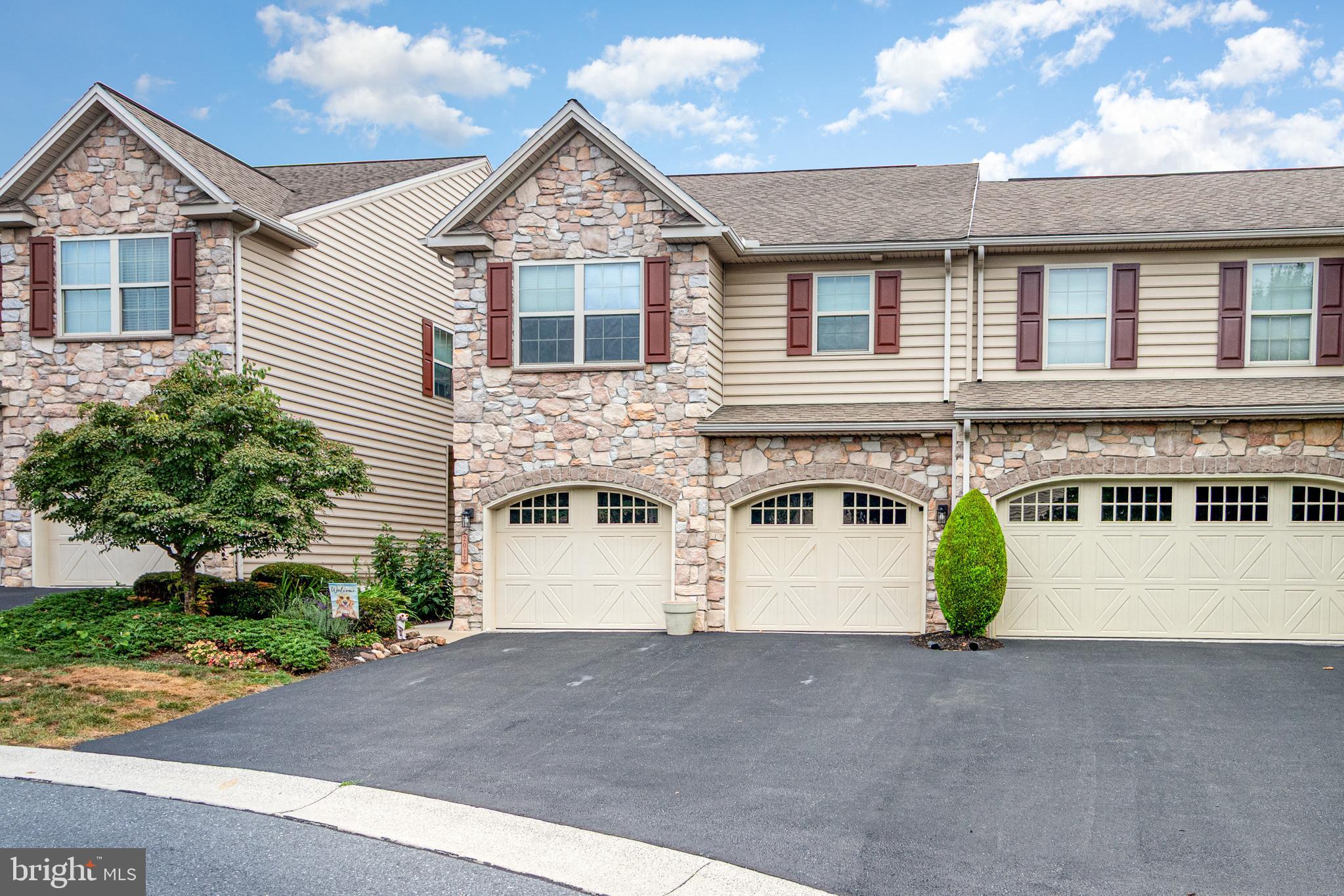 Welcome to this beautifully updated 3-bedroom, 2.5-bath home located in the highly sought-after Winding Hills Community and Mechanicsburg School District! This well-cared-for home offers over 2,000 sq. ft. of luxurious living, which blends modern comfort, style, incredible amenities, and minimal maintenance. Stepping inside, you are greeted with an inviting open-concept main floor featuring updated LVP flooring, a dramatic 2-story great room with a striking Palladian window, and a cozy gas fireplace—perfect for relaxing or entertaining. The kitchen and dining area are equipped with stainless steel appliances and flow seamlessly into the living space. Upstairs, you’ll find three spacious bedrooms, laundry, and two full baths, all with updated LVP flooring. The primary suite features a large walk-in closet, a full bathroom with a double bowl vanity, and makes the perfect retreat at the end of the day. Enjoy resort-style living with access to 120 acres of scenic open space, walking trails, a clubhouse, fitness center, and a sparkling community pool. Other features include a 2-car attached garage with epoxy flooring, central a/c, natural gas heat, and a large unfinished basement perfect for storage and ready for your ideas and creativity. Conveniently located close to it all. Don’t miss your chance to call this incredible property home—schedule your private tour today and see all this home has to offer!