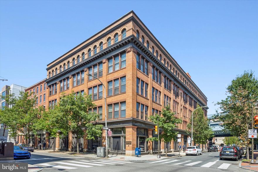Experience city living at its finest in this charming studio condo at 301 Race St, located in the historic Wireworks building. Enter in through the picturesque courtyard through the secure entry where you are greeted by an open modern lobby area which hosts the mailboxes and package room. The condo is located conveniently on the first floor. This unique space blends modern amenities with industrial charm, featuring exposed wood beams that add a touch of character. The studio boasts a lofted bed for optimized living space, custom built-in shelving and large floor to ceiling windows. There is a spacious kitchen with plenty of cabinet space featuring a stainless steel oven and refrigerator along with a dishwasher. You'll also appreciate the convenience of an in-unit washer and dryer, as well as additional elevated storage within the unit. For those with extra storage needs, there's even more space in the basement along with a bike storage room. This condo is perfect for anyone seeking a cozy, well-designed home in one of Philadelphia's most sought-after locations. Whether you're a first-time homebuyer or looking for a city retreat, this condo has everything you need. Don’t miss the opportunity to make this unique and functional space your own!