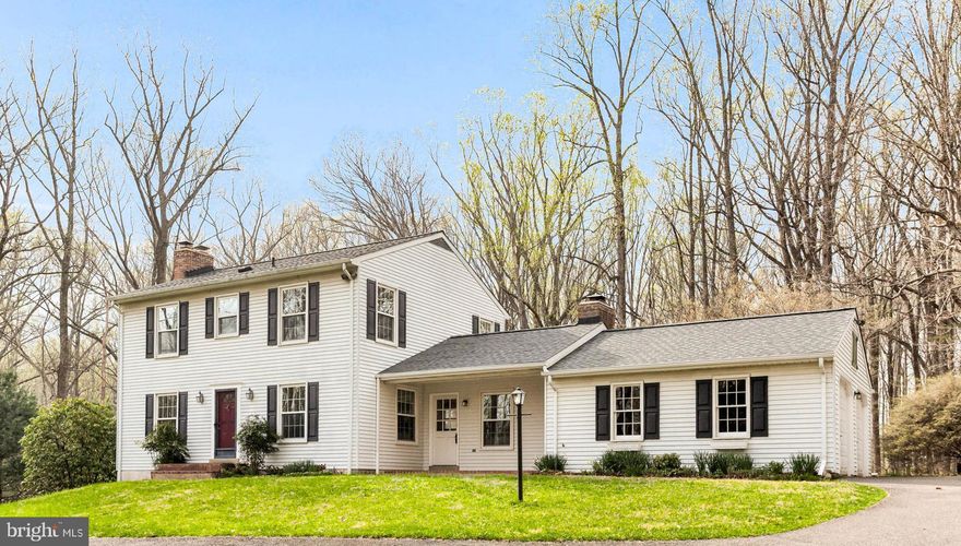 Welcome Home!  Meander up the driveway to this beautiful, well-maintained Colonial home!  Perched perfectly on 5 acres and surrounded by trees, it truly is a private oasis.  Once you enter the home, you will appreciate the gleaming hardwood flooring, which were refinished just last week!  The open concept, featuring a family room with a fireplace and a wood stove insert, a dining room, and a kitchen, allows for wonderful entertaining or simply relaxing in the evening.  The upper level features four bedrooms, hardwood flooring, and two full baths.   Enjoy the tranquility of the backyard on your deck when the sun is shining, or retreat to the screened-in gazebo located right off the rear of the house should the rain start to fall.  There is an amazing free-standing/separate studio in the corner of the yard, complete with a window a/c unit and wall heaters for year-round use, accommodating whatever your heart desires.  The  20 x 12 exceptionally well-built shed with a lean-to will more than store all of your yard equipment.  Additionally, there is a garden with raised beds and a well ventilated chicken coop!  The Browns Bridge Patuxent Reservoir Watershed and Recreation Area is literally one minute away, where you can kayak, fish, or simply birdwatch.  All of this, including excellent schools and centrally located right on the MC/HC line.  Easy access to Rockville, Washington, DC, and Baltimore via 29, 95, 200.  Fabulous schools!