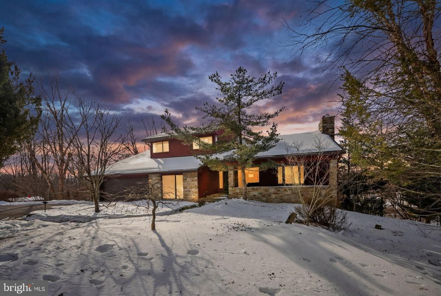 Nestled in the serene enclave of Western Run, this gorgeous contemporary residence offers a peaceful retreat in nature's beauty. Spanning 4.75 acres, the property boasts a picturesque backdrop of trees, scenic vistas and stream. The interior features an open floor plan that seamlessly connects the family room and dining area, perfect for entertaining. The gourmet kitchen, adorned with upgraded countertops and a cozy table space, is a culinary enthusiast's dream. With five spacious bedrooms and three and a half baths, including a primary suite with an elegant bath. Enjoy cozy evenings by one of the two fireplaces. The fully finished basement with a walkout entrance adds versatility, while the expansive deck invites outdoor gatherings. Additional highlights include a two-car garage, huge pantry, lower level storage, energy-efficient solar array, and a charming shed. Come and be delighted!