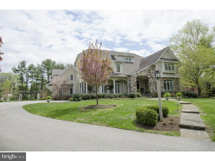 Combine elements of a newer constructed residence with one-of-a-kind Arts & Crafts inspiration, a highly desirable location in the heart of Radnor Hunt Country, in a quiet neighborhood and the result is a truly unique property that cannot be replicated. This home is proudly situated on a wonderful two acre property with flowering trees, mature plantings, grand terrace with extensive perennial gardens creating impressive outdoor living spaces?sure to instill "pride of ownership"! Entering the portico for front entry and wraparound covered porch floored in flagstone, you will be immediately enamored by a high level of sophistication yet with a casual feel characterized by "Southern Living" hospitality. The property was carefully designed and constructed by current original owner with a particular emphasis integrating indoor & outdoor living spaces, with outdoor access from many rooms on the main level. Its endearing presence sets the stage for an interior equally remarkable. Offering about 6,200 sq. ft. of refined living space, this home has an outstanding open flow, generously proportioned rooms but with a sensibility and comfortable feel hard to come by. The second floor is refreshingly different with four generously sized bedroom suites, each offering extra large windows, interesting ceilings, and bright, expansive halls/landings not the "traditional" dark narrow halls that define typical colonials. Hallmarks include arched halls and doorways, fabulous mill work, three fireplaces, one with dry stacked stone from floor to ceiling. Whether it's grand-scale entertainment or just a pleasurable day-to-day lifestyle you're seeking, this home delivers on every front! Complete with well appointed finishes, tasteful decor and appointments? it stands apart from the newer construction you've come to expect and seen before too often. A delight to visit and so much better to call "home"!