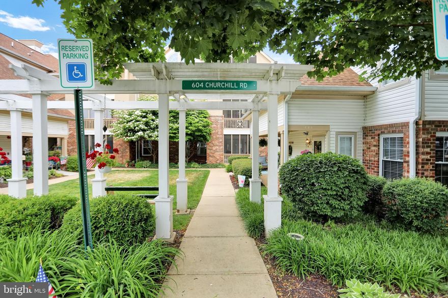 Gorgeous patio level 2 bedroom, 2 bath condominium in English County Manor. This end unit shines with  natural light and updates throughout. Exceptional gourmet kitchen with  tons of cabinet space, granite counter tops and updated black steel appliances.  Some of this units features include: Updated flooring throughout, recently updated bathrooms, Updated HVAC system & Hot water heater (2018), Beautiful primary suite with backlit trey ceiling, en-suite bathroom and large walk-in closet. The modified in unit laundry area with full size  updated washer and dyer is enclosed with a pocket door. Then there is the outdoor space that few units in the community offer, including a screened porch & deck backing to a wooded area and adjacent to a green space. This unit is a private retreat yet convenient to everything!