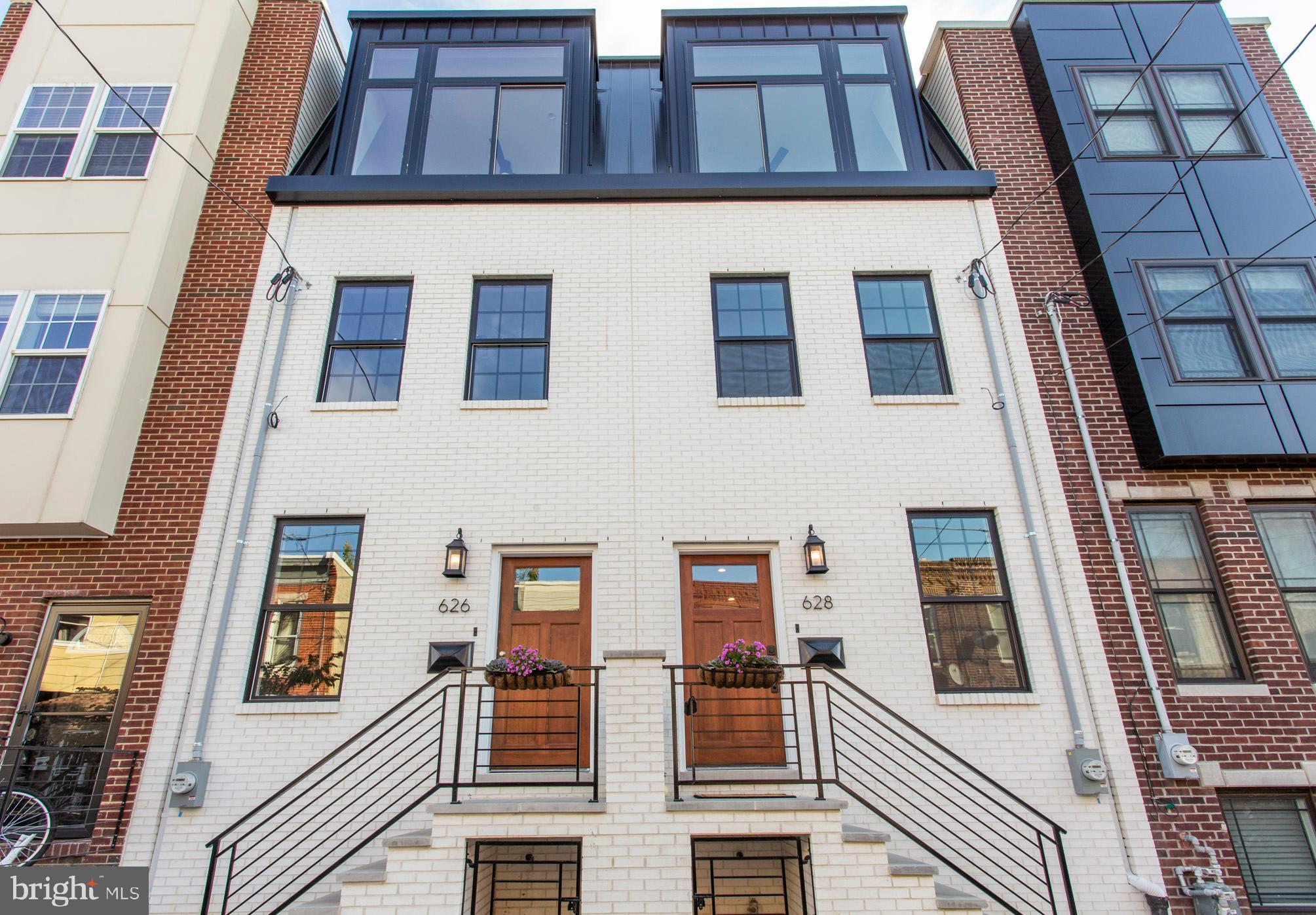 Introducing the Views at Hoffman Place! This unique collection of homes are inspired by European sleek elegance and design. All white brick facade features an exceptional black mansard style roof mimicking those found along the canals of Amsterdam and throughout London. Located in the Dickinson Narrows section of South Philadelphia, just a few blocks from Bok Bar, Passyunk Ave and Pennsport neighborhood, this location is accessible to everything. Enter the first floor living and dining area to find an open-concept design. All white kitchen displays the classic white subway tile, white quartz custom counter tops and custom cabinetry. Black accent hardware and an above range pot filler complete this contemporary look. Off the kitchen, you have a fenced in patio, perfect for entertaining and dog lovers. Ascend to the second floor which features two large sun filled bedrooms with giant custom windows and closets. A hall bathroom and convenient laundry room finish off the second floor level. A fabulous bi-level master suite with soaring ceilings and full wall windows offers incredible natural light. Dual closets with custom sliding barn door, linen closet and a large en-suite bathroom with custom design and sleek spa ambiance complete the 3rd floor oasis. Walk up the pilot house lined with contemporary black lantern wall sconces to find a custom bar with mini refrigerator perfect for roof deck entertaining. Incredible two tier rooftop deck with explosive 360 degree views of Center City skyline, river, bridges and stadium make this the ideal spot for entertaining. The finished lower level creates a rare fourth bedroom and en-suite bathroom with plenty of storage and built in shelving. Also could be a perfect home office, media room, play room or gym. 10-year property tax abatement has been submitted. Dual zone HVAC system Exceptional craftsmanship and attention to detail throughout the house in a neighborhood with new construction being built all around. Convenient to Center City, transportation and major highways