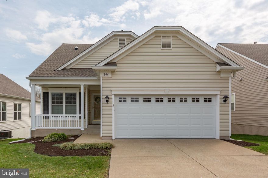 Welcome to easy, elegant living in the sought-after Del Webb Falls Run community! This immaculate 3-bedroom, 3-bath James model offers a bright, open layout with gleaming hardwood floors throughout and a classic center hall design.

The sun-filled kitchen sits to the left of the entry and features stainless steel appliances, light cabinetry, a pantry, abundant prep space, and a convenient pass-through to the dining area—perfect for entertaining. The main level showcases a spacious family room/dining room combination with a cozy gas fireplace, mantle for displaying treasures, and large windows enhanced by plantation shutters and honeycomb blinds for both style and efficiency.

A front guest bedroom is paired with a full bath featuring a solar tube for natural light, while the laundry room—also located at the front of the home—offers direct access to the garage for easy grocery unloading. The serene primary suite is tucked at the rear of the home and includes a large walk-in closet and an en-suite bath with dual vanities and a walk-in shower.

French doors lead to a cozy upper deck with stairs down to an additional outdoor entertaining space and backyard area. The finished lower level expands your living options with a spacious Recreation Room featuring a second gas fireplace, a third bedroom with private en-suite bath—ideal for guests—and an oversized utility room with ample storage for seasonal décor, tools, and more.

Residents of Falls Run enjoy resort-style amenities including indoor and outdoor pools, a fitness center, pickleball and tennis courts, walking trails, billiards, meeting spaces, concierge service, and an on-site activity director. Conveniently located near Fredericksburg, with easy access to shopping, dining, medical facilities, and commuter options—this home truly has it all!