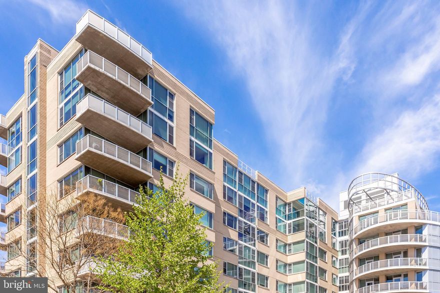 Light-filled, quiet, modern and spacious 1,040 sq ft 2-bed 2-bath corner apartment with oversized windows and large 100 sq ft private balcony overlooking tree-lined neighborhood. Hardwood floors, high ceilings, kitchen island with seating, stainless steel appliances, solar shades and blackout blinds, double vanity and soaking tub in master bath, washer/dryer inside unit. Professionally managed building with concierge, fitness center and rooftop deck. Walkscore = 94! 2-blocks from Virginia Sq Metro with non-stop service to both downtown DC and Tysons Corner. Bus stop in front and easy access to bike lanes, I-66, I-395 and both airports. Walking distance to Clarendon, Ballston, FDIC and George Mason University. Trader Joe's, Whole Foods and Giant supermarkets nearby. Storage space included. Corner Unit w/ East-South-West Orientation and Top-Floor Feeling, Views of Ashton Heights Tree-Lined Neighborhood, Two Blocks from Metro w/ Non-Stop Service to Downtown DC, Convenient Access to Both National and Dulles Airports, Local Bus Stop Outside Building Entrance, Pedestrian and Bike Friendly Neighborhood, Within Walking Distance to Both Ballston and Clarendon Shops and Restaurants, Two Blocks from Giant Supermarket, Four Blocks from Trader Joe's, Seven Blocks from Whole Foods, Underground Parking Space, Separate Storage Space, Large Balcony w/ Floor-to-Ceiling Window , Oversized Corner Windows in All Rooms, 9'+ Ceilings, Hardwood Floors, Built-In Closets, Open Floor Plan, Kitchen Island w/ Dining Combo, Quartz Countertops, Stainless Steel Appliances, Shades/Blinds, Soaking Tub, Washer/Dryer Combo, Central A/C, Forced Air Heat Pump, Condominium Renovated in 2014, Professional Building Management, Concierge, Fitness Center, Bike Room, Rooftop Deck w/ Garden and Outdoor Dining Area, Large Lobby, Monitored Alarm System, Keyless Controlled Access. Call today for your private showing!