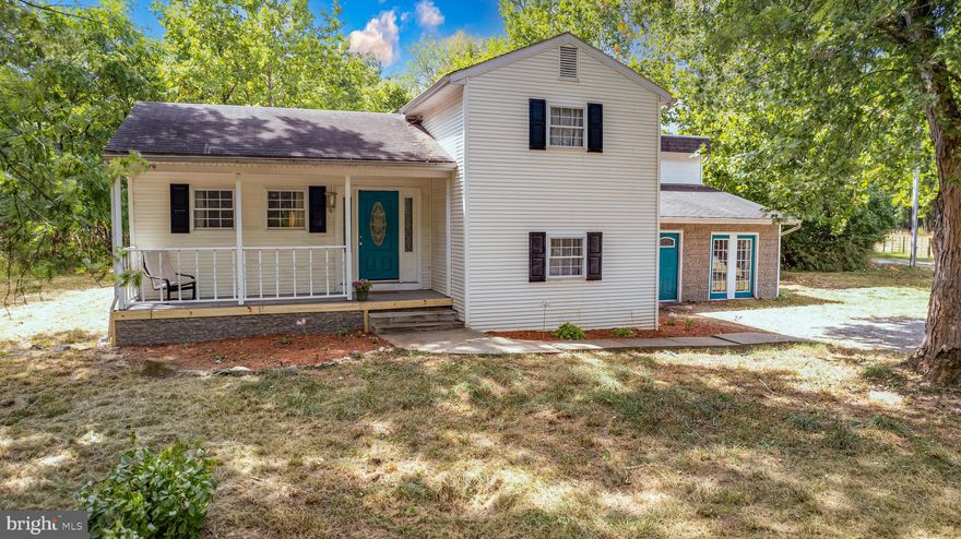 $10,000 allowance toward upgrades! 1.5 acres with no HOA. Close to VA line. Currently used as 2 units. Could make for an excellent rental property.  Tri-level main home with covered front porch to sit and enjoy your morning coffee or listen to the rain. Beautiful hardwood floors in the main level living area.  Spacious remodeled kitchen with lots of cabinets, granite countertops and stainless steal appliances. Dining area extends off the kitchen area. 3 upstairs bedrooms with a pass through room that could be used for office/den etc.,  plus a full bathroom upstairs. The additional suite has main level bedroom with a door to the backyard and patio, full bathroom plus a separate kitchen laundry, living area and storage room. Large backyard, new storage shed and a concrete backyard  patio.