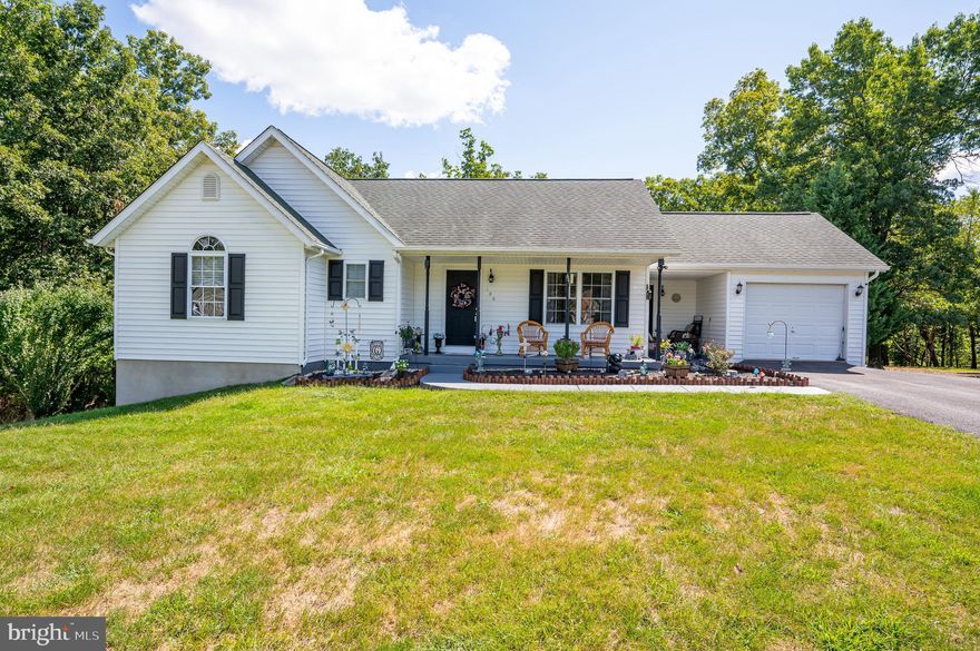 This charming 3 bedroom, 2 bath rancher is situated close to the end of a cul de sac in a park like setting.  Sit and relax and watch the season unfold on either of the two front covered porches, or the rear deck.  The rear yard is partially fenced, with mature trees and nature abounding.   On the main level there is a semi open floor plan. with cathedral ceiling. The kitchen is overlooking into the dining and living room (which has new LVP flooring).   There is a hall bathroom and 3 bedrooms, one being the primary with  a walk in closet and private bath.  Inside the one car garage is a heated and insulated laundry room.   The lower level has a pellet stove, two closets for storage which are also insulated,  and plenty of area to  finish to suit your style.    The hot water heater was replaced within approx a year ago, and the HVAC approximately 2 years ago.   Beautifully landscaped and all this sitting on .50 acres, within miles of i-81, Proctor and Gamble, and area attractions.  Call for your private tour!