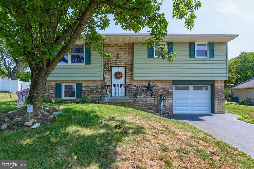 3 bedroom bi level home featuring kitchen with dining area, sunroom and finished lower level with half bathroom. One car garage and rear deck that leads to spacious backyard.