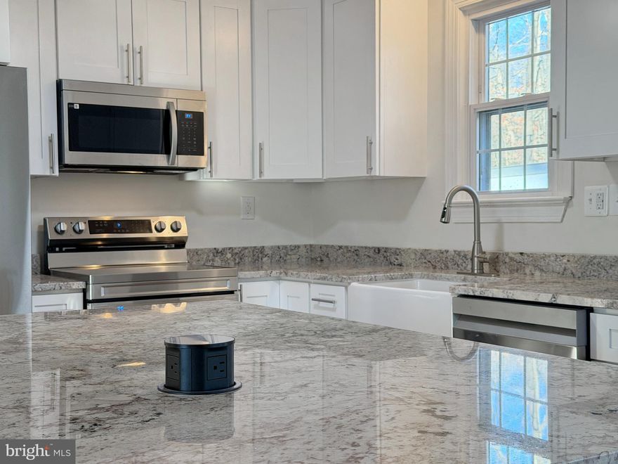 Welcome to 9350 Mathir Drive in La Plata, Maryland—an exceptional newly remodeled home set on a spacious 2-acre lot with no HOA and no town taxes. This versatile property offers two brand-new kitchens with custom all-wood cabinets with soft close features, one on each level, making it ideal for multi-generational living or added flexibility. With five bedrooms and two full bathrooms, the layout provides generous living space designed for comfort and functionality.
The home features all hardwood throughout the main level and waterproof luxury vinyl plank flooring in the lower level with no carpet, creating a clean, modern feel that’s easy to maintain. Additional highlights include a convenient carport and a Generac backup generator for peace of mind year-round. Surrounded by open space yet close to local amenities, this property delivers privacy, practicality, and modern upgrades in a desirable La Plata location.