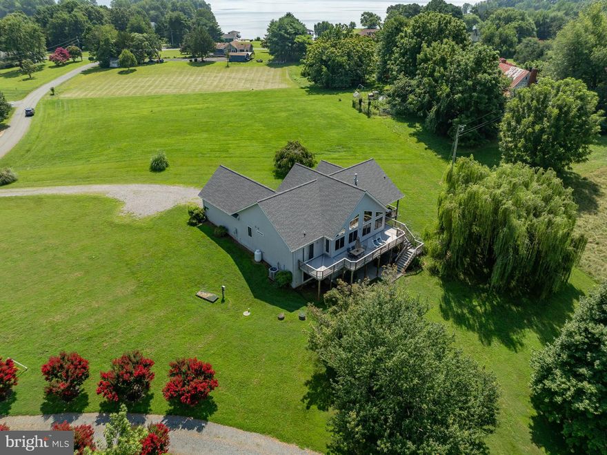 Welcome to an exceptional lakefront retreat in the prestigious Bear Castle community on the of Lake Anna—offering the perfect blend of refined luxury, relaxation, and income potential.
Perfectly positioned on a private 1.01-acre cul-de-sac lot with nearly 100 feet of waterfront, this stunning 4-bedroom, 3-bath custom home delivers the elevated lake experience today’s vacation renters seek. With expansive water views, high-end comfort, and turnkey convenience, this property is ideally suited for immediate income generation.
Inside, the open-concept design is bathed in natural light, with dramatic lake-facing windows ,rich wood flooring, a cozy fireplace, and thoughtfully designed gathering spaces create a warm yet upscale atmosphere.
The main-level primary suite and additional entry-level bedroom provide desirable accessibility for multi-generational guests, while the finished walkout basement expands entertainment space—ideal for game rooms, movie nights, or additional guest accommodations.
Outdoors, the experience truly sets this property apart. Guests can unwind on the expansive deck, relax in the hot tub, or enjoy seamless access to the water from the deep-water covered dock—perfect for boating, swimming, fishing, and watersports. These sought-after amenities significantly enhance rental appeal and occupancy.
Additional features include:
• 3,690 finished square feet designed for high-capacity hosting
• Offered fully furnished for immediate move in or rental readiness
• New roof (2023) for peace of mind
• New water pump and pressure tank (2026)
• 2-car attached garage 
• Hot tub and invisible fence convey

Located in a quiet, desirable waterfront community with lake privileges, this property offers the rare combination of privacy, luxury, and strong income potential on one of Virginia’s most in-demand vacation destinations. 
Whether you're expanding your short-term rental portfolio or securing a personal getaway that pays for itself, this Lake Anna retreat delivers both lifestyle and return on investment. Located near Lake Anna grocery, shopping, and more AND only 40 minutes from the new Kalahara Waterpark and Kings Dominion.