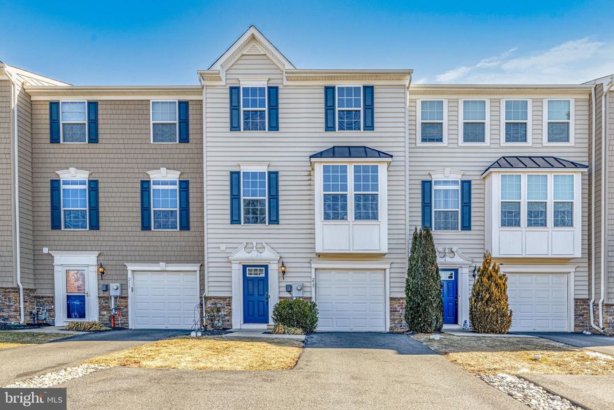 Welcome to this beautiful 3-bedroom, 2.5-bath townhome offering modern comfort and convenience in a fantastic location! The main level is bright and open, featuring a spacious living room, dining area, and kitchen—perfect for entertaining. The sleek kitchen boasts black cabinets, ample counter space, a center island, gas stove, stainless steel appliances, and a double sink. Just off the dining area, double glass sliding doors open to a balcony, ideal for morning coffee or evening relaxation. Upstairs, the primary suite features a walk-in closet and private full bathroom. Two additional bedrooms and a full hall bath complete the upper level. The finished lower level complete with a half bath provides extra living space and has double glass doors leading outside. The space would be perfect for a home office, gym, or entertainment area. Plus, enjoy the convenience of a 1-car attached garage for covered parking or extra storage.  Don't miss this opportunity to own a stunning townhome in Gilbertsville!