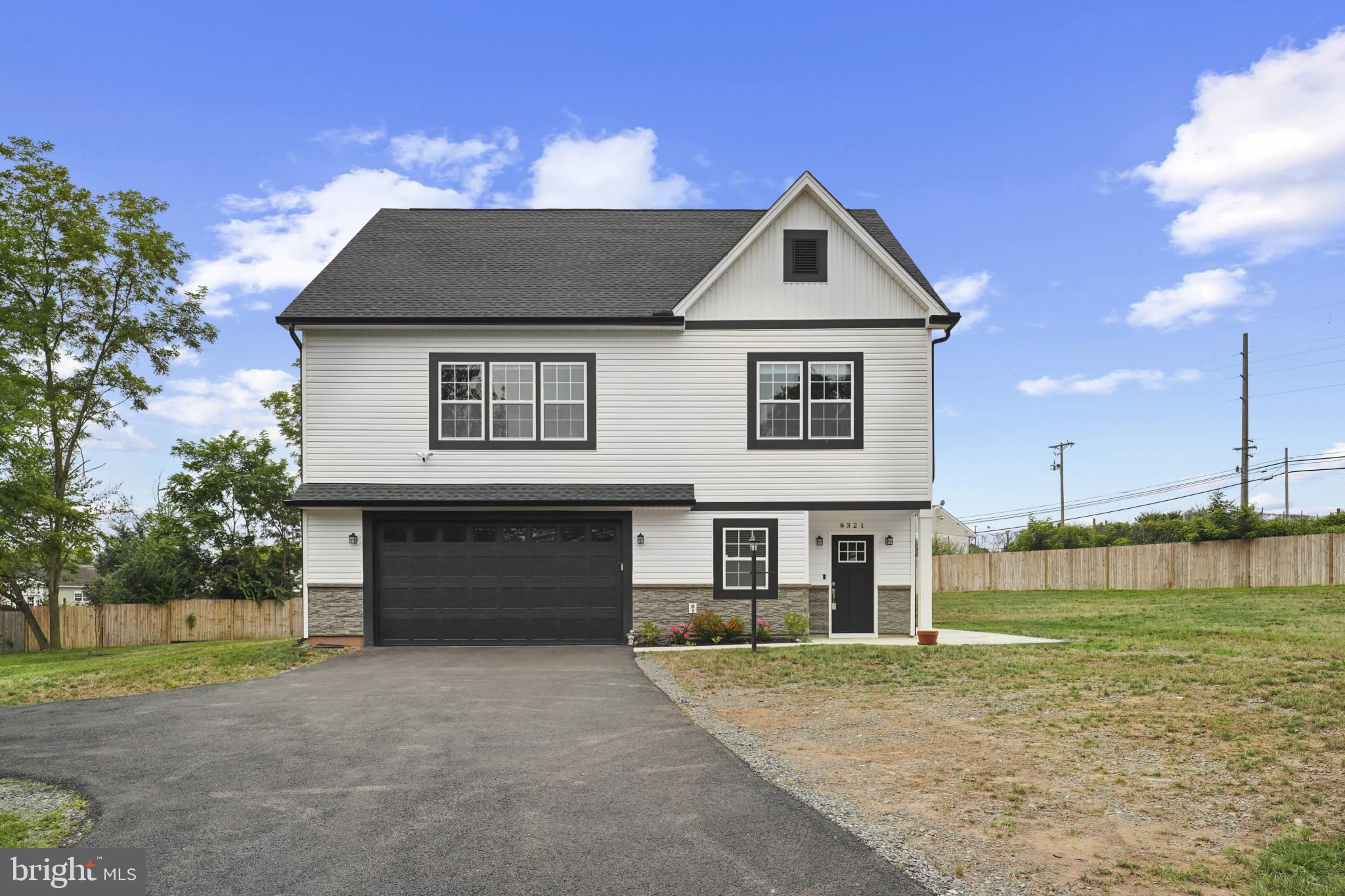 This almost brand new custom colonial sits on over half an acre of level land in a peaceful, established neighborhood located right off Route 28 and just minutes from I-66. The home features a striking exterior with stone, vinyl, PVC finishes, and architectural shingles. Inside, 9-foot ceilings on both levels enhance the open feel, leading to a beautifully designed kitchen with quartz countertops, a custom tile backsplash, 42-inch soft-close cabinets with 6-inch pulls, a large island, and stainless steel appliances. Over 50 recessed LED lights brighten the space throughout. The main level and staircase are finished with water- and scratch-resistant luxury vinyl plank flooring and custom handrails, while oversized bedrooms include plush carpeting, ceiling fans, and recessed lighting. Three bedrooms offer private en-suite bathrooms with full wall tile showers, soaking tubs, and vinyl plank flooring. Additional features include crown molding on the main level, a tray ceiling in the primary suite, an oversized garage with epoxy floors and a double-insulated door, extra storage, energy-efficient windows, and 6-inch rain gutters. A fully fenced lot and 250+ foot driveway add to the home’s privacy and functionality. Enjoy the convenience of nearby shopping, dining, and commuter access, all from the comfort of this modern and spacious home.