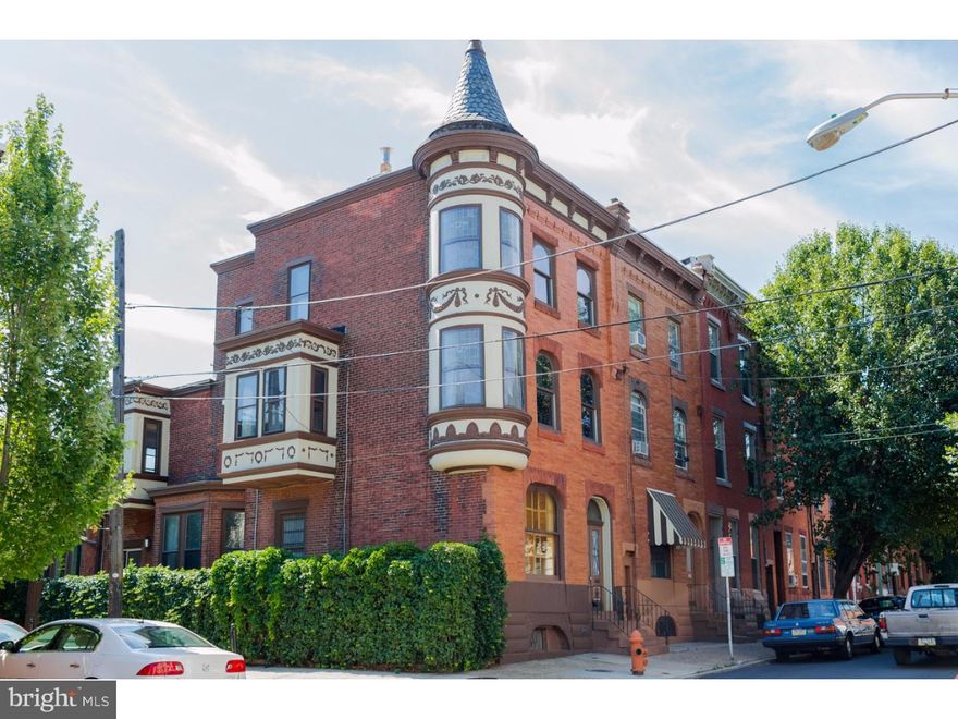 Welcome to this magnificent 4 bedroom 2 bath corner Victorian home in Northern Liberties. One of the things you will notice from the outside is the dramatic architectural projections called Turrent Windows. On the inside, most of the original period details remain in incredible condition such as crown molding, in-lay hardwood floors, Lincrusta walls throughout (this is a beautiful embossed wall covering popular in Victorian homes), as well as glass and tile work throughout. Enter in through a formal tiled vestibule with a stained glass transom above the French doors. The vestibule leads to a formal foyer where you can enter through mahogany pocket doors into the parlor/living room. The living room is adorned with an original wood mantle and mirror, ceramic chandelier, as well as original leaded glass windows. Through the foyer you can access a huge dining room with stained glass French doors, service access to the 2nd floor level, a decorative mantle, crystal chandelier, and walk through to an enormous eat in kitchen. We love the radiant heated terracotta Moroccan inspired tile floor. The kitchen has an eat in nook and has been modernized to include abundant work space with polished granite counters, beautiful cabinets, stainless appliances, a 5 burner gas range with range hood, and an area for a breakfast bar. The kitchen is filled with natural light and there is access to a lovely brick paved side yard perfect for entertaining. The 2nd floor of this home has 2 massive size bedrooms and either the 2nd or 3rd floor would make an incredible master suite. Each room on the 2nd and third floors has its own personality and unique features including stained glass, curved original trim work, mantles, solid wood built-ins, and unique architectural features due to the Turrent Windows. There is a large updated hall bath on the 2nd floor with subway tile walls and octagon tile floors, pedestal sink, glass enclosed shower, and a linen closet. The 3rd floor has 2 more large rooms and the 2nd full bath. The 3rd floor hallway leads to a door to the roof (could be future roof deck). There is radiator heat throughout with gorgeous decorative iron radiators, dual zoned central air, a full unfinished basement that runs the entire length of the home, high ceilings and a laundry area. A full list of the home's original details is available but there is nothing like seeing it for yourself. We hope to see you soon!