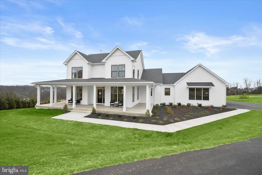 Introducing this exceptional brand new Georgia model by Greenspring Homes in Shamrock Estates, set on nearly two acres. Offering four bedrooms and three full bathrooms, this move-in ready home showcases high-quality finishes throughout. Tucked at the end of a long driveway, the property welcomes you with a covered wraparound porch and a convenient two-car garage. Inside, a modern neutral palette, tall ceilings, and abundant natural light create an inviting atmosphere. The foyer opens to beautiful hardwood floors, a formal dining room ideal for entertaining, and a spacious living room with a cozy gas fireplace. Prepare your favorite meals in the gourmet kitchen that is fully equipped with stainless steel appliances, quartz countertops, a tile backsplash, soft-close shaker cabinetry, and a center island. A breakfast nook offers space for casual meals, while the walk-in pantry adds excellent storage. A laundry room with built-in cubbies and garage access complete this side of the home. The main level hosts an exquisite primary bedroom suite with a walk-in closet and a spa-like bathroom featuring a dual-head walk-in shower, double vanity, linen closet, and separate water closet. A second bedroom and full bathroom are also on this level. Upstairs, you will find two additional bedrooms, a shared full bathroom, and two generous hall closets. The unfinished walkout basement awaits your personal vision, offering rough-in plumbing for an additional bathroom and ample space for future rooms. Enjoy exceptional modern living in this brand-new home designed with comfort, style, and functionality in mind.