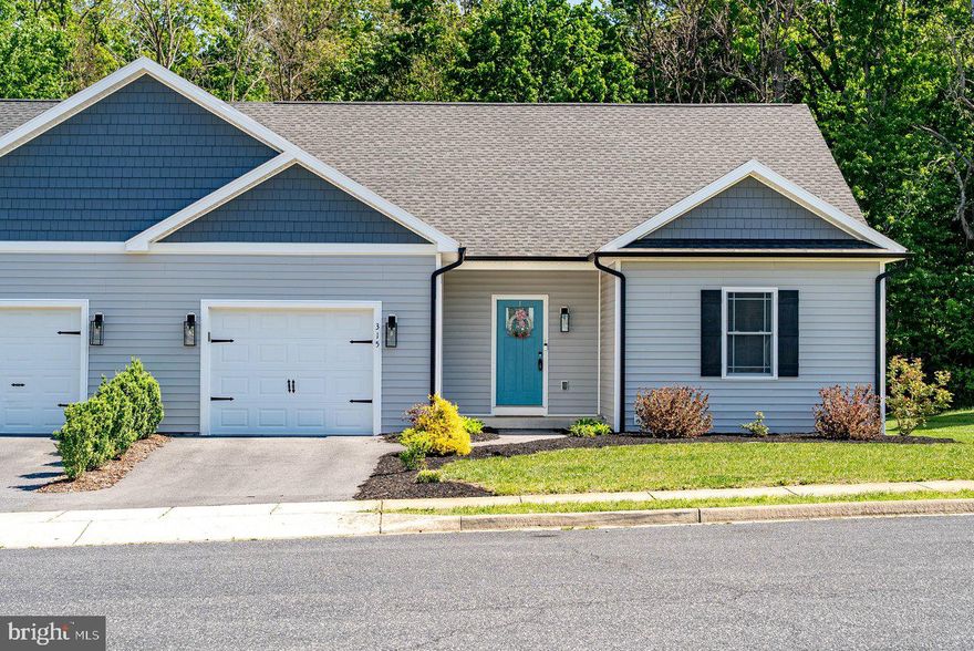 Enjoy easy, single-level living in this beautifully maintained duplex located in a quiet neighborhood in the town of Elkton. Built in 2022, this home offers modern finishes, thoughtful design, and low-maintenance comfort. The open-concept layout of the living area is enhanced by 9’ ceilings and abundant natural light throughout. The kitchen is a standout with granite countertops, stainless steel appliances, recessed lighting, and a spacious walk-in pantry, perfect for everyday living and entertaining.  The large primary suite features double windows that fill the space with natural light, a generous walk-in closet, and a private bath with double sink vanities. A second full bath also includes double vanities, offering convenience for guests or family in the two additional bedrooms.  Enjoy outdoor living with a deck just off the kitchen and dining area, overlooking a flat, fully fenced backyard with high-quality, low-maintenance vinyl fencing, ideal for relaxing, pets, or play.  Enjoy the professional landscaping for an added bonus.  This move-in ready home combines fresh paint, modern style with practical living in a peaceful, quiet setting with wildlife to enjoy in the adjacent woods.  Washer replaced 5/2026.