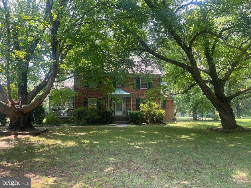 Solid Brick Colonial with 4 bedrooms, 2 baths on 2.6 acres of open land. The home boasts hardwood floors, a fireplace, a separate dining room, and a screened porch. Located in town, close to shops and restaurants.