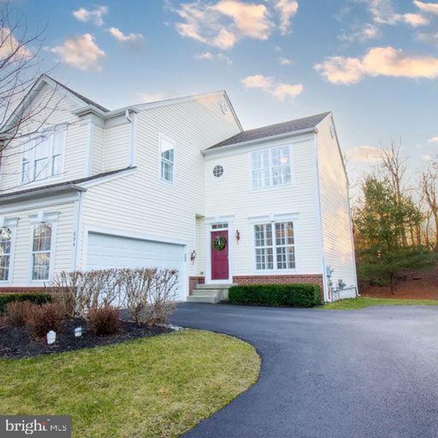 The premium carriage home you have been waiting for is now available in the ever popular Windsor Ridge community of Chester Springs. This Rosedale model is an end unit featuring 3 bedrooms, 2.5 baths, and a 2 car garage. The benefits of this end unit are accentuated by the home’s premium lot that backs to wooded space. Upon entering the home you’ll come across espresso hardwood floors upgraded in 2020. You’ll notice 9 foot ceilings on the first floor complemented by crown molding and wainscoting in the living and dining rooms. The windows are adorned by beautiful white plantation shutters for added elegance throughout the home. Exploring further you enter the two story Great Room with floor and ceiling windows to add to the natural daylight. This space features a mounted TV above the gas fireplace. Off the Great Room sits the bright kitchen with stainless steel appliances and large preparation island to supply the amenities and space for your culinary needs. Appliances are included with the purchase of the home for the enjoyment of the new owner. The kitchen glides into the morning room that supplies extra gathering space and has a walk-out sliding glass door that exits onto a large low maintenance deck backing to wooded space. A hallway with wainscoting provides entry to the powder room, laundry room, and 2 car garage. A stroll to the second floor leads to three bedrooms, two full baths, and a bonus loft area. The master suite features crown molding, tray ceiling, ceiling fan, large walk-in closet, dual sink vanity, frameless glass walk in shower, and a soaking tub. The second bedroom near the master suite is a conveniently located nursery currently used as an office with beautiful beadboard, crown molding, ceiling fan and spacious closet. The third bedroom is particularly generous in size and features a walk-in closet, attached full bathroom, crown molding, and ceiling fan. All bedrooms feature elegant white plantation shutters, and the bonus loft area of the second floor provides the family with a range of potential uses for this space. The home is just minutes away from Route 100, Route 30, and the PA Turnpike. Convenient location is within minutes of Marsh Creek State Park, Chester Valley Trail, and Main Street at Exton, and craft breweries with a wealth of dining and recreation opportunities. The Windsor Ridge community has an outstanding clubhouse with fitness center, meeting room, ballroom, pool and tennis courts, basketball courts, walking trails and playgrounds surround the community. The home is within the highly rated Downingtown SD, with STEM!