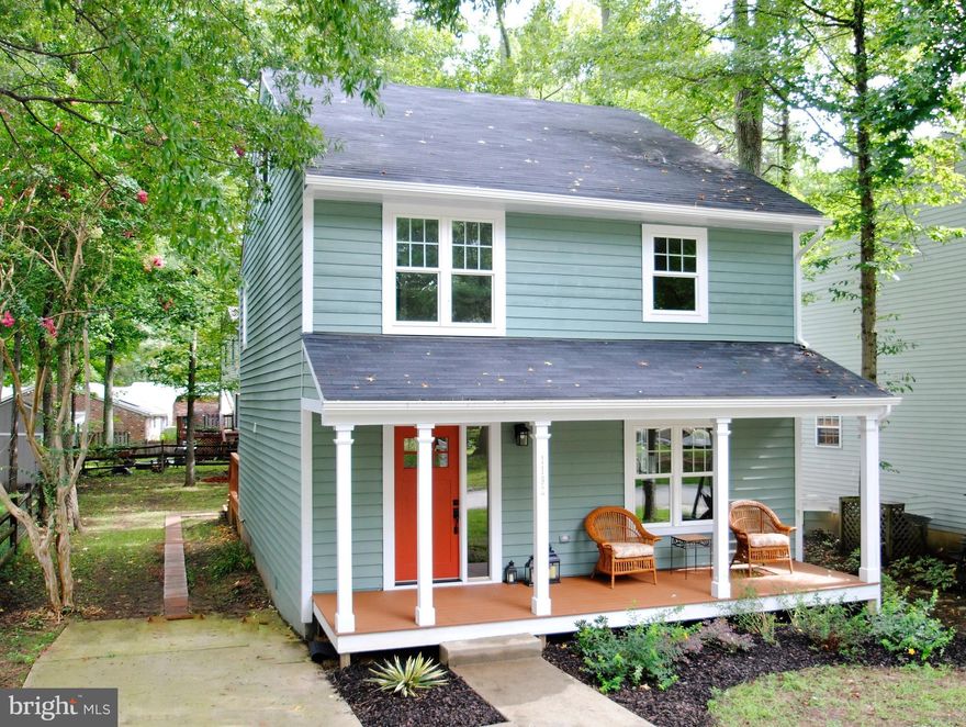 REDUCED.This charmer has been renovated top to bottom with open spaces,bamboo floors,designer baths & finished third floor for you to personalize.Wooded lot with play areas in water privileged community. Walk 1 block to launch area & community beach. Enjoy relaxing on the front porch with neighbors & entertaining on the 2 level 11x23 rear deck. Close to shops & commuter routes yet a world away.