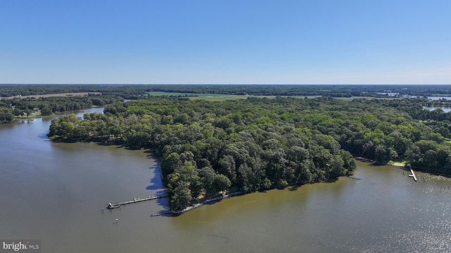 This amazing property is like no other.  Private w/ deep water.  The winding private driveway leads to tennis court & tennis house w/ it's own driveway or stay on the main driveway to the main house.  The main part of the main house was built w/ materials from a 1700s barn.  Incredible beams, floor, doorways & more!  3 story great room w/ full stone fireplace & chimney.  This dwelling provides 4 bedrooms & 2.5 baths spanning 3 stories, plus a lookout tower.  There is also an efficiency apt. over the garage w/ its own water views.  Roof &  HardiPlank siding are reasonably new.  There is an accessible crawl space & house generator.  Interior is very unique & special, still ready for your upgrades.  The tennis house has 4 rooms, reception area, a kitchenette, full bath & sauna.  It is far enough away from the main house to provide its own sandy beach front, great views & privacy.  DO NOT ENTER PROPERTY W/O APPOINTMENT!