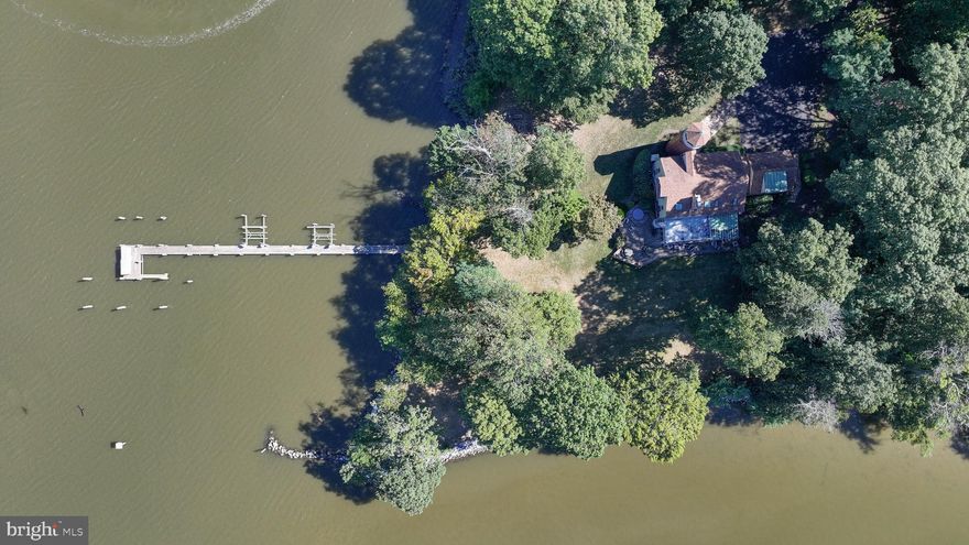 This amazing property is like no other.  Private w/ deep water.  The winding driveway leads to tennis court & 2-story tennis house w/ it's own driveway or stay on the main driveway to the main house.  The main part of the main house was built w/ materials from a 1730 barn.  Incredible beams, floor, doorways & more!  3 story great room w/ full stone  chimney w/ gas fireplace.  This dwelling provides 4 bedrooms & 2.5 baths spanning 3 stories, plus a lookout tower.  There is also an efficiency apt. over the garage w/ its own water views.  Roof &  HardiPlank siding are reasonably new.  There is an accessible crawl space & house generator.  Interior is very unique & special, still ready for your upgrades.  The tennis house has 4 rooms, reception area, a kitchenette, full bath & sauna.  It is far enough away from the main house to provide its own sandy beach front, great views & privacy.  DO NOT ENTER PROPERTY W/O APPOINTMENT!