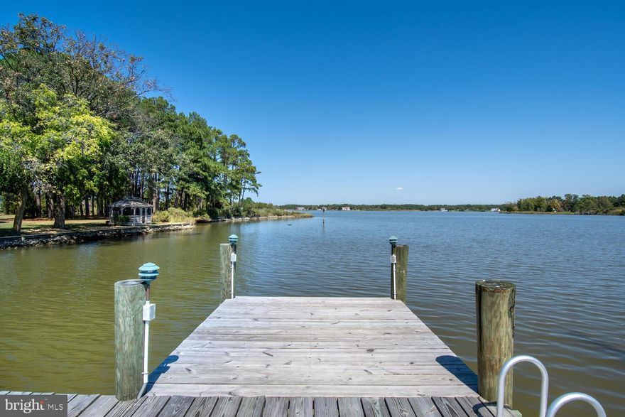 Stunning 4-bedroom, 3 and 1/2 bath waterfront home on scenic Church Creek! MOST FUNISHINGS CONVEY!!!!This spacious residence boasts an open floor plan perfect for entertaining, with abundant natural light and open, airy rooms.  Kitchen, dining room and great room with fireplace afford stunning waterviews of the river. The first floor primary bedroom offers convenience and privacy as well as gorgeous waterviews, A second bedroom, study, full bathroom and laundry room complete one wing of the downstairs. Opposite wing affords a craft room, sunroom, half bath and garage. Upstairs you will find two large bedrooms and an expansive bathroom. One of the bedrooms provides access to a rooftop deck , where you can relax in the hot tub while soaking in the beautiful views. You will also enjoy outdoor living on the large deck , complete with a pergola, perfect for relaxing or entertaining while enjoying the views of the creek.  There is a gazebo and detached garage as well as a nice pier and boatlift.  An ideal waterfront retreat! Just pack your bag and enjoy your stay at your vacation home or make it your permanent residence. Move-in ready!