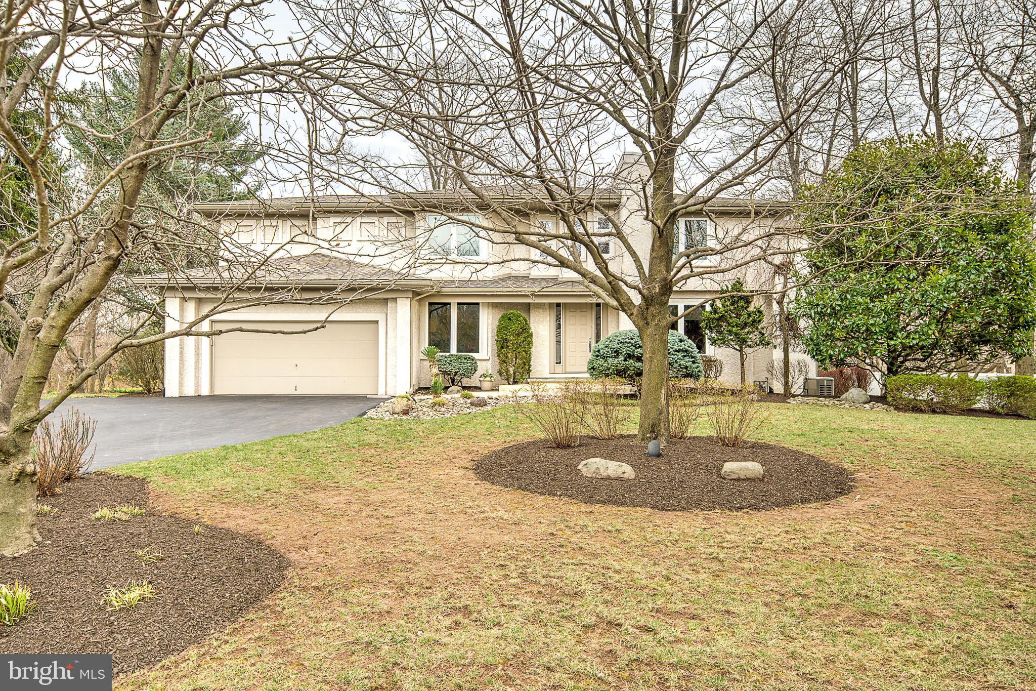This exceptional home offers endless features, starting with solid maple flooring and a gourmet kitchen fit for the next great chef, complete with a built-in Regency gas fireplace. Enjoy ample space for a full eat-in kitchen and a bar area overlooking the family room and backyard. Step outside to two-tier decks with stunning views.
A versatile office (or playroom/sewing room) is conveniently located off the main family room. Entertain with ease in the elegant butler’s pantry/bar area, perfect for holiday gatherings. The formal dining room sits adjacent to a cozy living room, while the original family room boasts vaulted ceilings, large windows, and picturesque views. A second office or library, offering a quiet and versatile space, is located just off the foyer.
Additional highlights include a two-story open foyer, custom features throughout, four-zone heating, a Kohler gas generator, a water purification/softening system (GAC), less than a year old Thermador double ovens, and high-quality Caroma toilets.
A major addition in 2010 expanded the home to include two spacious family rooms and an exceptional primary suite. The suite features a stunning see-through gas Montego fireplace, visible from both the bed and the luxurious primary bath with a jetted freestanding tub, as well as a cozy reading room. The expansive walk-in closet offers built-in organizing systems for ultimate convenience. The second-floor laundry room offers convenience with a sink, mini-refrigerator, and built-in storage, including space for ironing. All bedroom closets feature custom organizing systems, with each bedroom offering a full wall of closet space. The junior suite, formerly the primary suite, includes a relaxing soaking tub and a separate shower area.
The (not included in SQ FT) basement is designed for ultimate entertainment, featuring ample space for gatherings, a gym, a home theater with a high-top bar and seating, plus a cozy lounge area for six. Additional highlights include two storage areas, a powder room, an artist’s or photography studio, and a convenient kitchenette.
