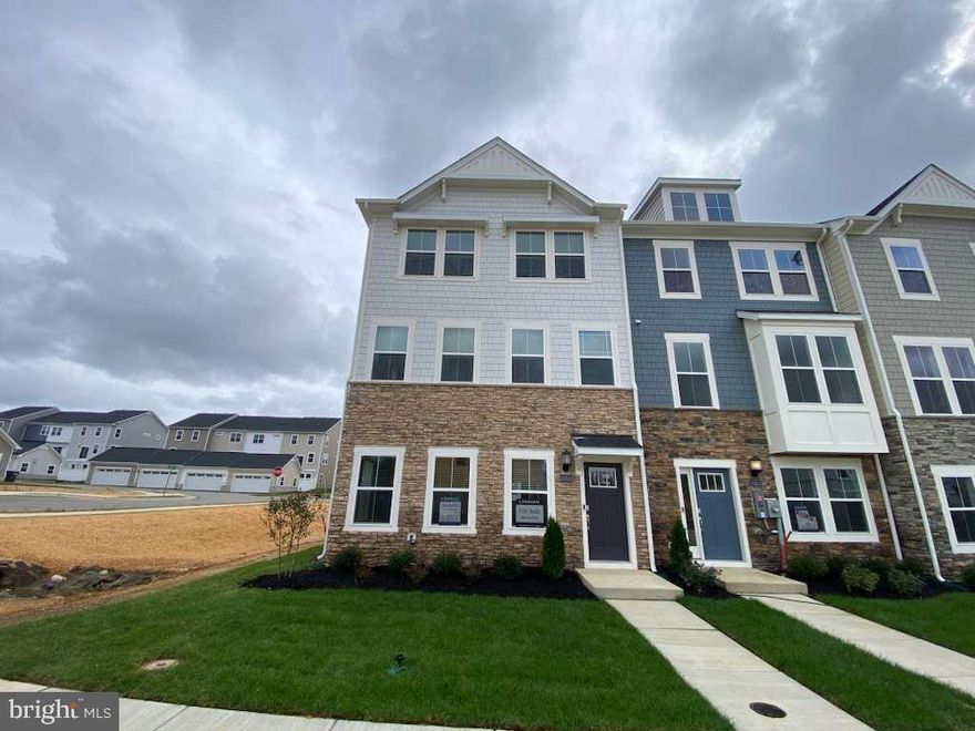 Welcome Home to the Ellicott Townhome with Detached 2-Car Garage St Charles - Highlands White Plains MD

Designed with both family living and entertaining in mind, this beautifully crafted three-story townhome offers space, style, and functionality in every corner.

The striking stone exterior adds a touch of modern charm, while inside, the first floor welcomes you with a flex space and recreation room with access to the backyard—perfect for play, guests, or a home office.

Upstairs, the open-concept main level features a spacious family room, gourmet kitchen with a stainless steel French door refrigerator, cooktop, double wall oven, dishwasher, and microwave, plus crown moulding, window blinds and elegant finishes throughout the home. The dining room flows seamlessly onto a composite deck with vinyl rails, creating the ideal indoor-outdoor experience. Wide plank flooring runs throughout the lower and main levels for a sleek, cohesive look.

Enjoy the convenience of a detached two-car garage, plus additional driveway parking for two more vehicles.

The third floor is home to all three bedrooms, including a primary suite with crown moulding, tray ceiling, a walk-in closet with natural light, private water closet, dual vanities, and a spa-inspired shower with built-in bench—your personal retreat after a long day.

Fun for the whole family starts in the heart of the home: the chef-inspired kitchen makes meal prep a joy, while the spacious bedrooms and smart layout offer room for everyone to relax and recharge.

Note: This home is scheduled for completion NOVEMBER 2025! Pricing and features are subject to change. Model photos shown for illustration purposes only.

Schedule your private tour today or visit us during our Weekend Open House hours to explore the floorplan in person.