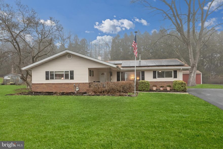 Welcome to your dream home! This charming ranch-style residence, built in 1962, offers a perfect blend of comfort and modern living. With 1,624 square feet of thoughtfully designed space, this delightful property features three spacious bedrooms and two full bathrooms, making it ideal for relaxation and entertaining. Step inside to discover a warm and inviting interior adorned with luxury vinyl plank and ceramic tile flooring. The family room, conveniently located off the kitchen, creates a cozy atmosphere for gatherings, while the formal dining area is perfect for hosting dinner parties. Enjoy the convenience of an entry-level bedroom and a primary bath that adds to the home's functionality. The kitchen is equipped with energy-efficient appliances, including a gas oven/range, dishwasher, and an extra refrigerator/freezer, ensuring that meal prep is a breeze. The main floor laundry adds to the ease of daily living. Outside, the half-acre lot is a true oasis, featuring a beautifully landscaped front yard, a serene rear yard, and side yards adorned with trees and vegetation. Enjoy peaceful views of the garden and woods from your patio or porch, perfect for morning coffee or evening relaxation. The community pool offers a refreshing escape during warm days. Additional highlights include a concrete driveway for convenient parking and a storage barn/shed for all your outdoor needs. With exterior lighting and a secure main entrance, this home is both inviting and safe. Don’t miss the opportunity to make this lovely property your own!