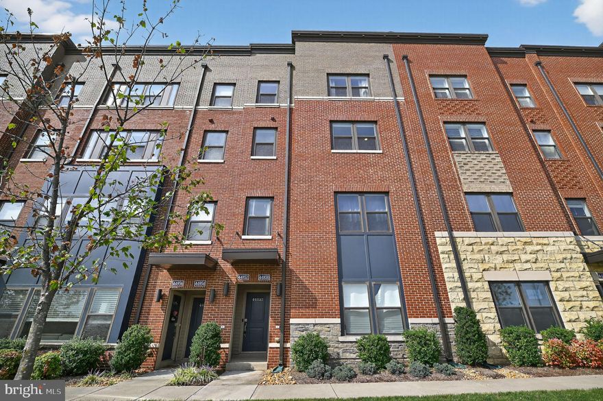 Impeccably maintained and full of enhancements, this expansive, two-story townhous- style condo in One Loudoun is a showstopper! ABOUT THE HOUSE: Spend the summer months in complete 360-degree privacy on the rooftop terrace complete with pergola, and cable hookup. The main living space is open concept with high ceilings and wide-plank LVP flooring throughout. The kitchen features many upgrades, including a 16’ island with plenty of seating, modern cabinetry with crown molding, granite countertops and backsplash, a built-in beverage fridge, and beautiful accent lighting above the cabinetry. The home also comes equipped with “Hue” smart technology for controlling the lighting in various rooms. The upper level includes 3 spacious bedrooms, laundry facilities, and 2 bathrooms. The primary suite has an enormous walk-in closet and ensuite bath with a luxurious stand-alone tile shower featuring a rain shower head, glass doors, and a shower bench. Fresh paint and carpeting enhance the overall appeal of this magnificent home, while an attached garage provides the storage space you need. 
ABOUT THE COMMUNITY: Living here will also give you access to the clubhouse, pool, dog park, tennis and basketball courts, and other community amenities that make One Loudoun so desirable. You're also in close proximity to many local restaurants and urban conveniences. 
ABOUT THE AREA: Access is a breeze to commuter routes, the train line into Washington D.C., your favorite shops & restaurants, the Alamo movie theater, the Dulles airport, local wineries/breweries, and more. This amazing location puts you right in the middle of it all!