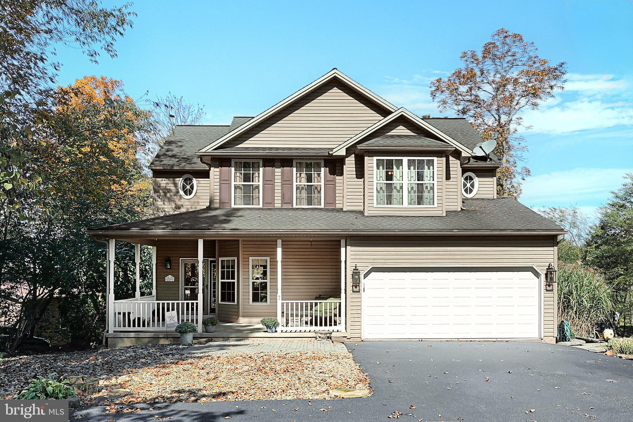 Welcome to Lakefront Living at Its Finest! All new and waiting for you! So much new stuff here. Freshly painted throughout, all new flooring, new HVAC system, ductwork, insulation, drywall and more. Step into your dream life on the water with this stunning 4-bedroom, 2.5-bath colonial nestled in the desirable Lake Meade community. Imagine waking up to breathtaking views from your expansive multi-tiered deck, perfect for enjoying great weather, entertaining guests, or just soaking in the beauty of your backyard oasis and the serene lake.
Inside, this home is designed for both comfort and style. Gorgeous wood floors flow throughout, leading to an open-concept kitchen and family room, where granite countertops, a gas fireplace, and seamless access to the deck make for effortless entertaining. Your private sanctuary awaits in the primary suite, complete with a spacious walk-in closet and an indulgent bathroom—ideal for unwinding after a day on the lake. Don’t miss your chance to experience lakeside living at its best—act now!